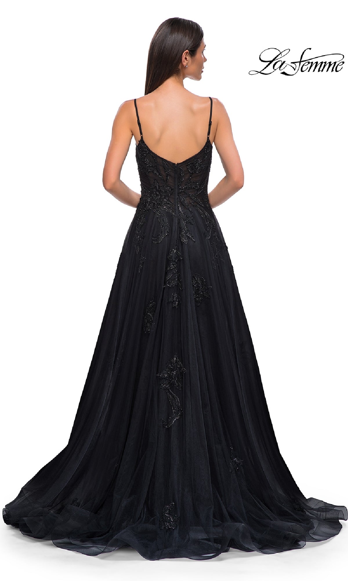 A woman is seen from the back wearing the La Femme 32781 long black glitter prom dress with thin straps, displayed against a white background. The La Femme logo appears in the top right corner.