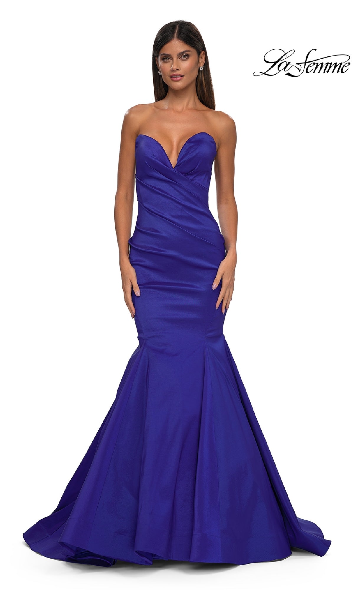 A woman poses in the Strapless Long Mermaid Prom Dress: La Femme 32791, a royal blue Mikado gown, against a white background with the