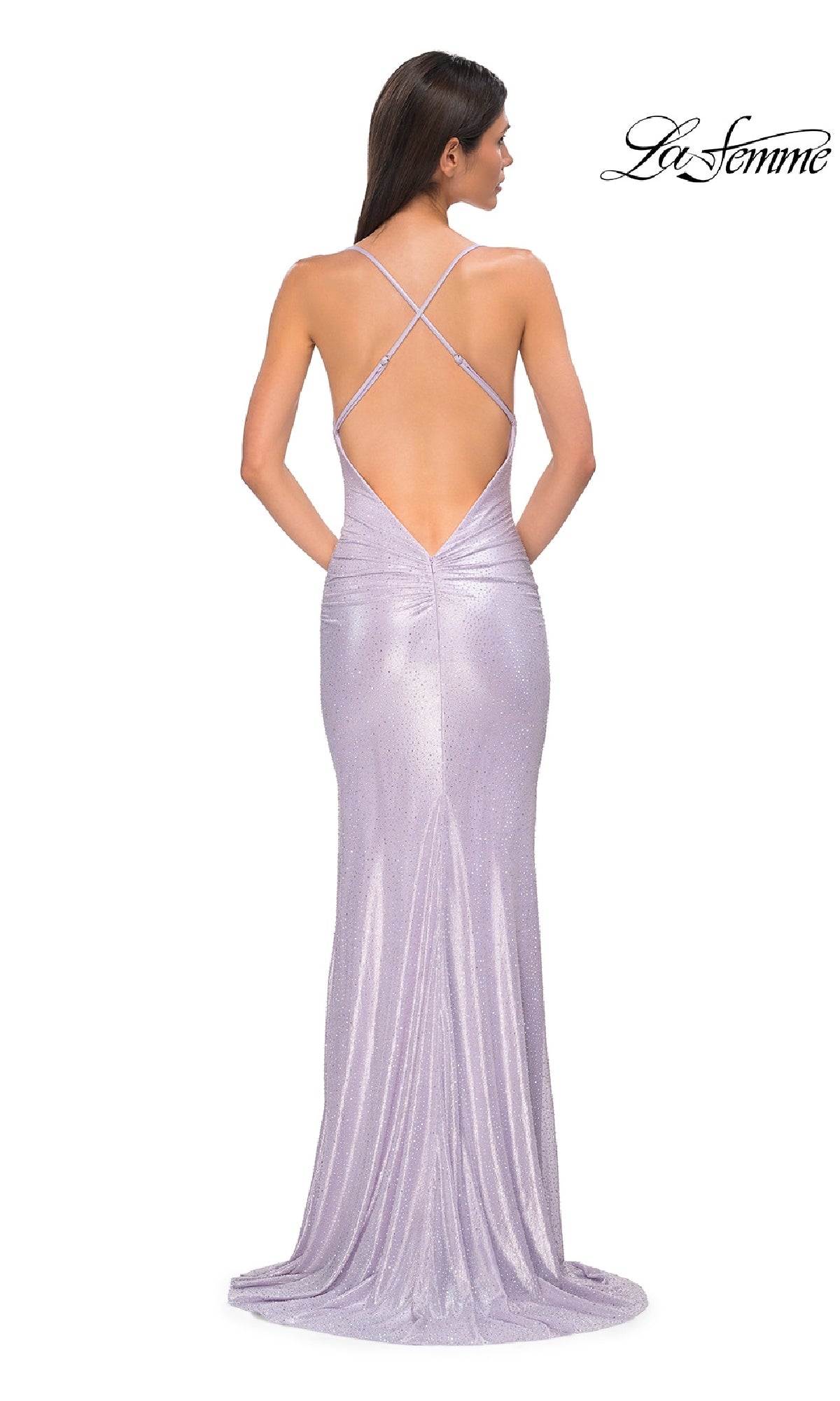 Woman wearing a shimmery lavender Metallic-Jersey Long Prom Dress (La Femme 32835) with a backless crisscross-strap design, facing away;