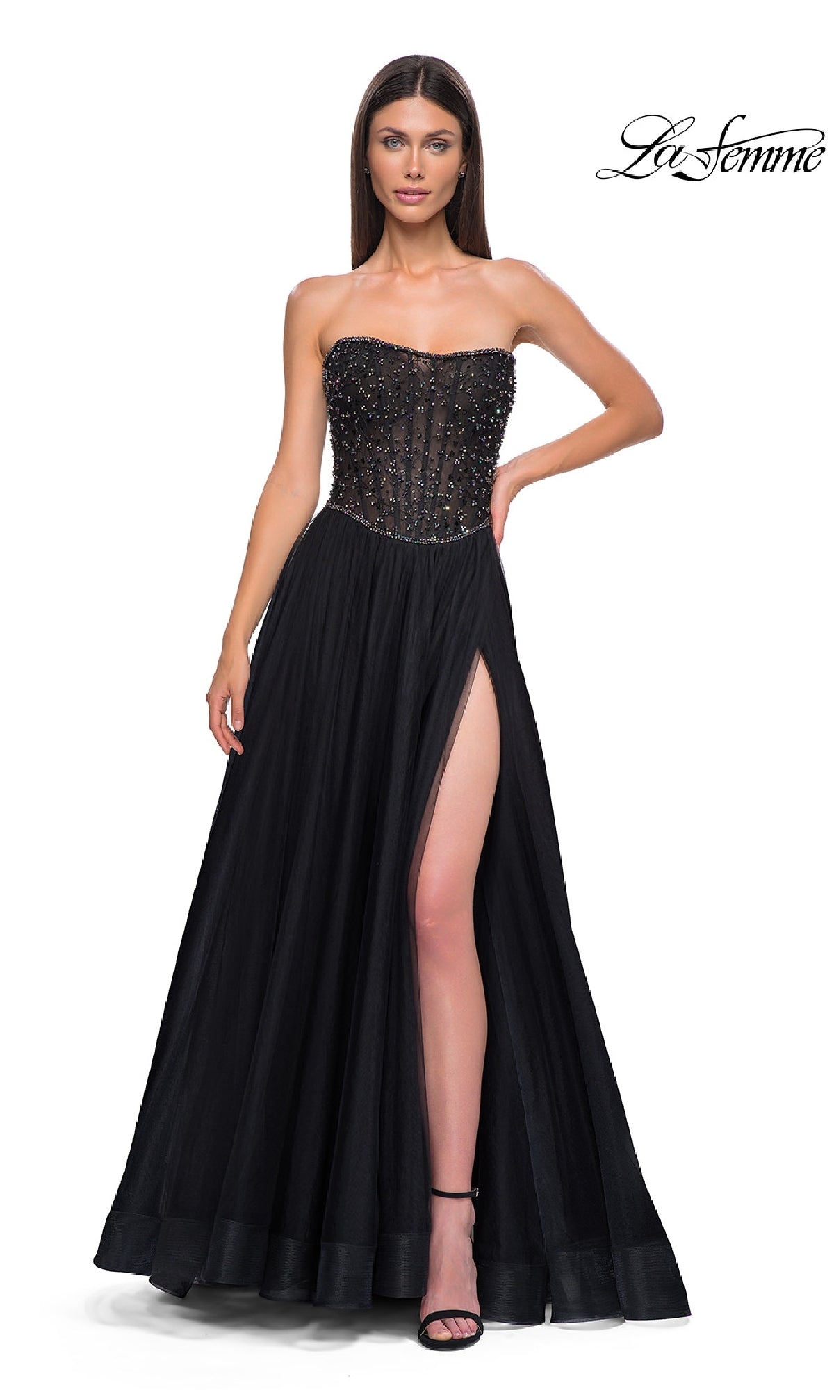 Woman in the La Femme 32856 strapless long black prom ball gown with a beaded bodice and high slit, standing against a white background. The La Femme logo appears in the top right corner.