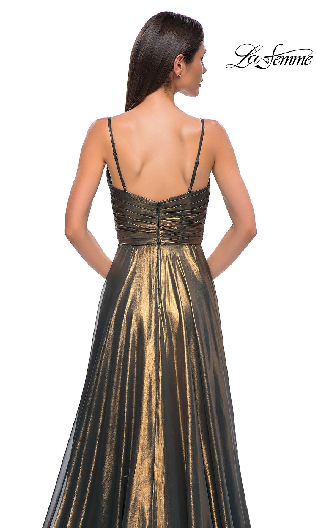 A woman faces away in the La Femme 32864—a dark gold, floor-length metallic chiffon prom dress with spaghetti straps and ruched bodice.