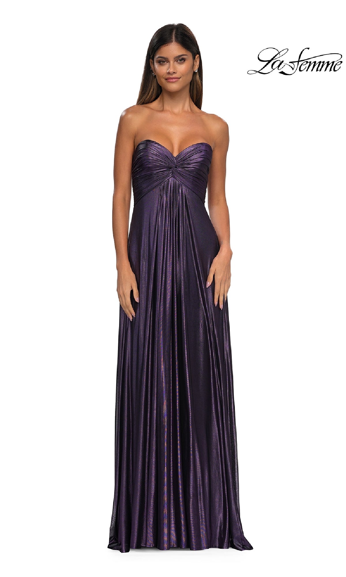 A woman models the La Femme 33047: a strapless, floor-length metallic purple prom dress with a ruched bodice, standing against a white background. The