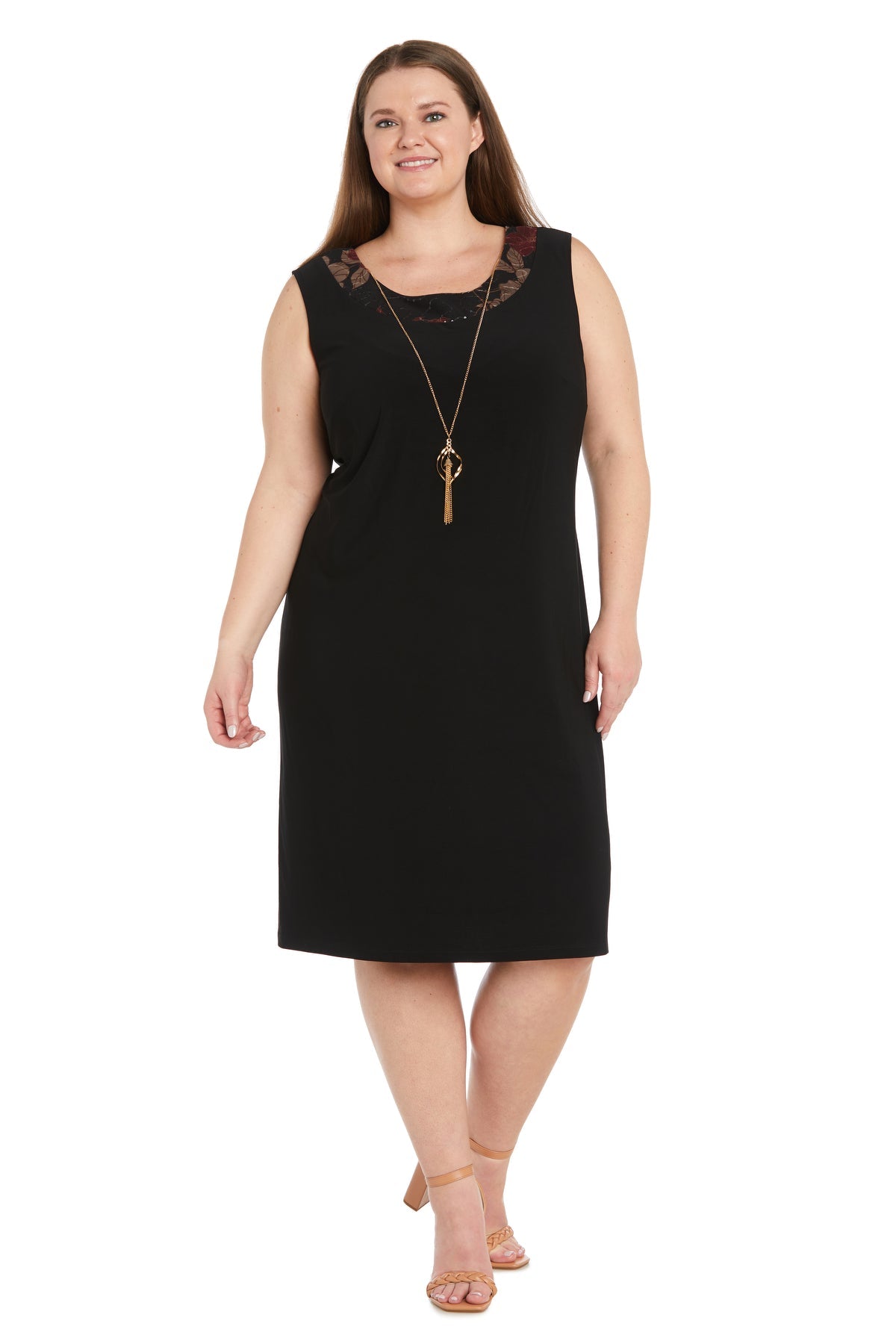 Woman wearing the Plus-Size Jacket Party Dress: R&M Richards 3312W, a sleeveless black knee-length dress with mesh neckline detail and long necklace, posing in beige heels against a white background.