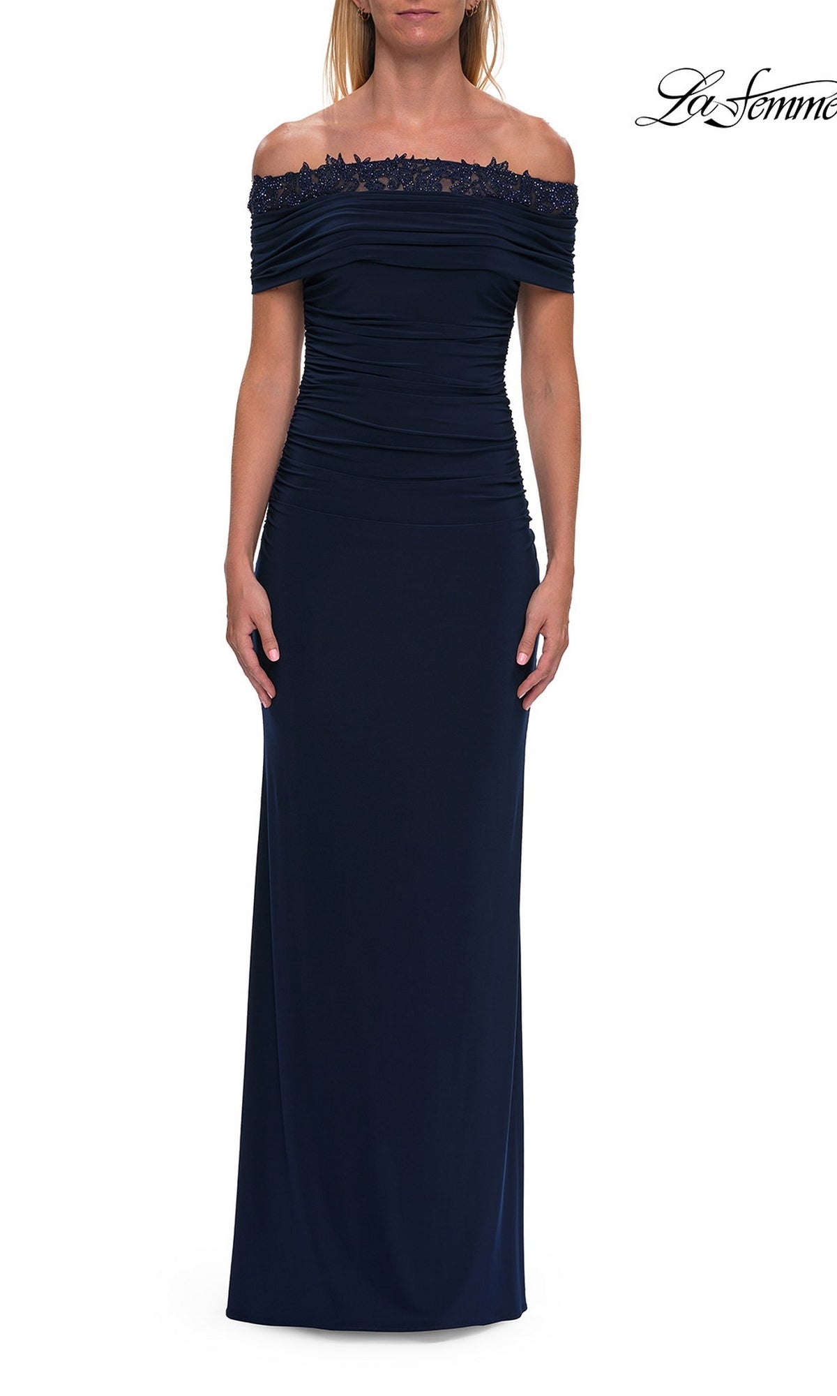 Model wearing the La Femme 33329 Lace-Trimmed Tight Long Prom Dress in navy, featuring an off-the-shoulder neckline, ruched bodice, and elegant lace trim, posed against a plain white background.