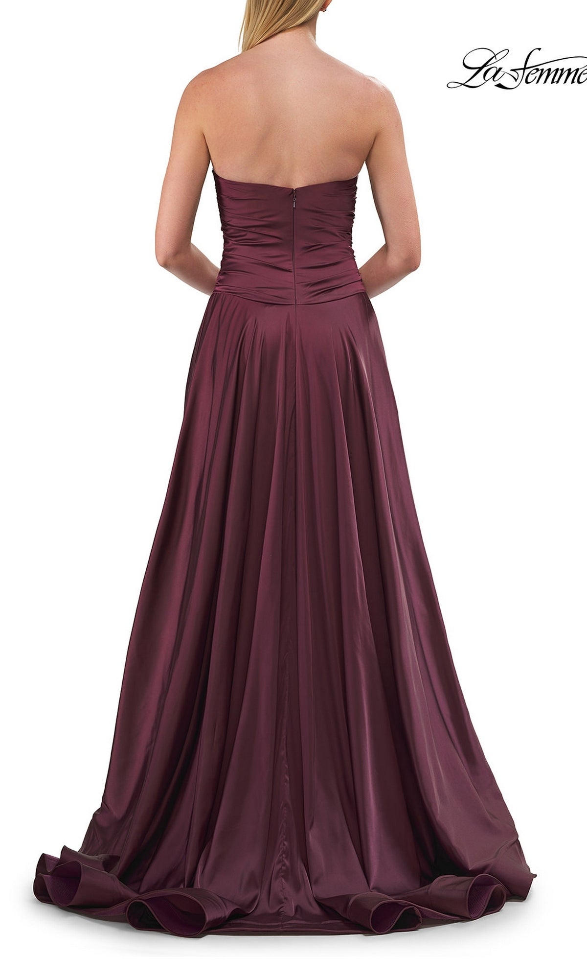 A woman shown elegantly from the back wearing the Strapless Sweetheart Prom Gown: La Femme 33417—a floor-length, deep burgundy formal dress featuring a ruched bodice and flowing skirt with a strapless sweetheart neckline.