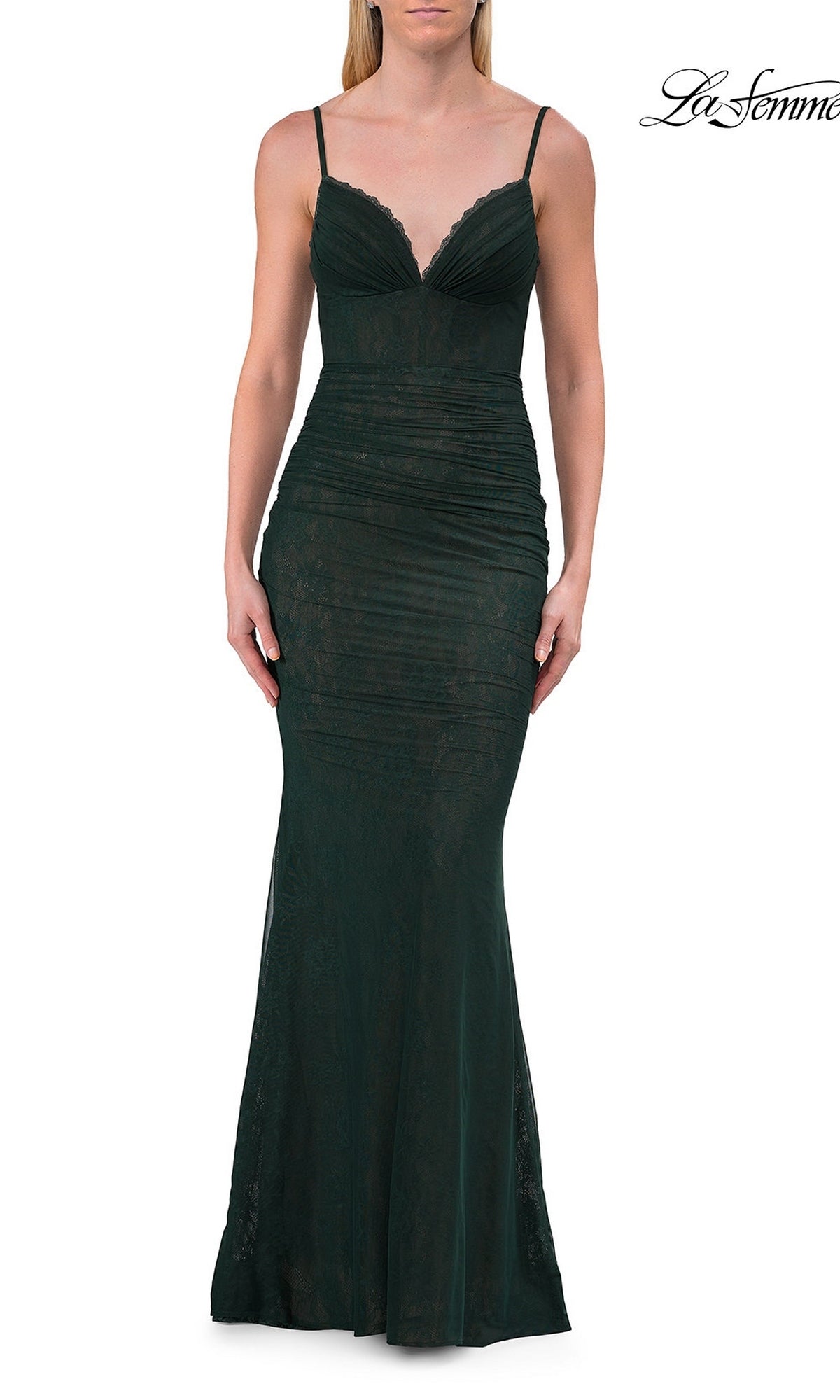 A woman stands against a white background wearing the La Femme 33443 Simple Long Lace Prom Dress in hunter green—a sleeveless, floor-length gown with thin straps and a fitted, ruched bodice.