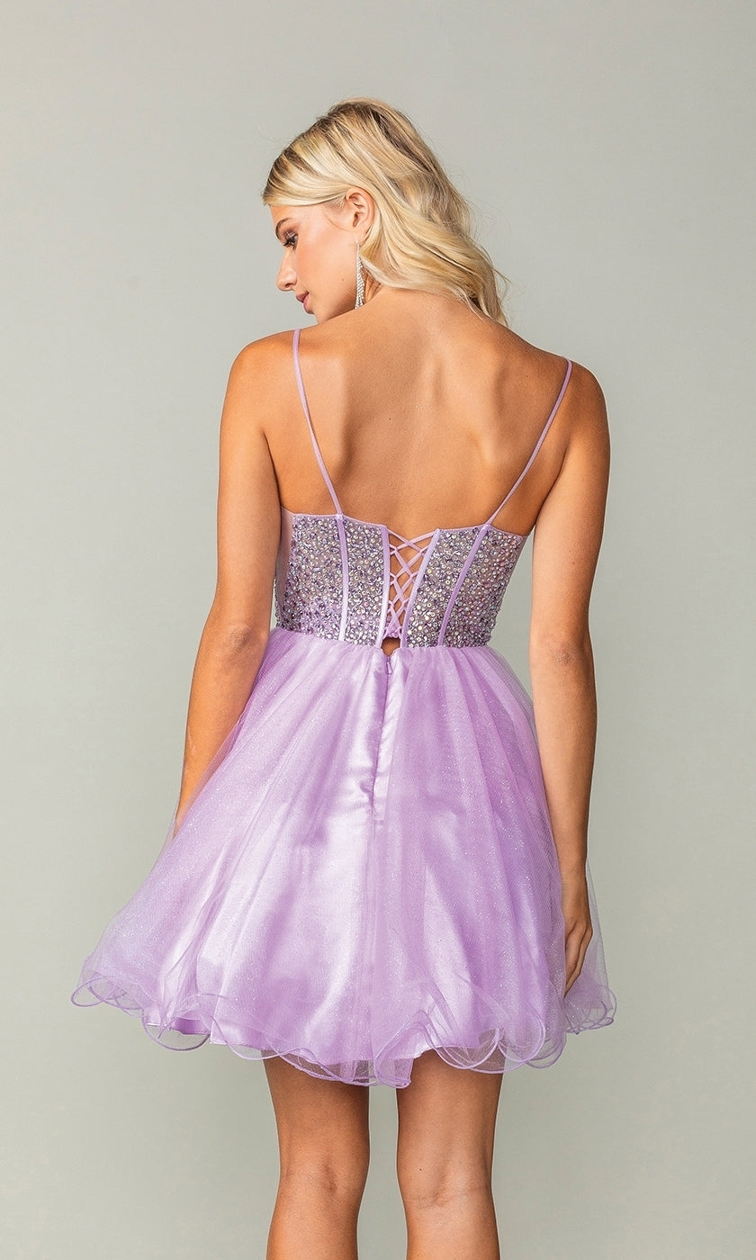 A blonde woman models the Beaded Corset Short A-Line Homecoming Dress 3353 in light purple, featuring thin straps, a lace-up back, and a sparkling beaded corset bodice against a plain background.