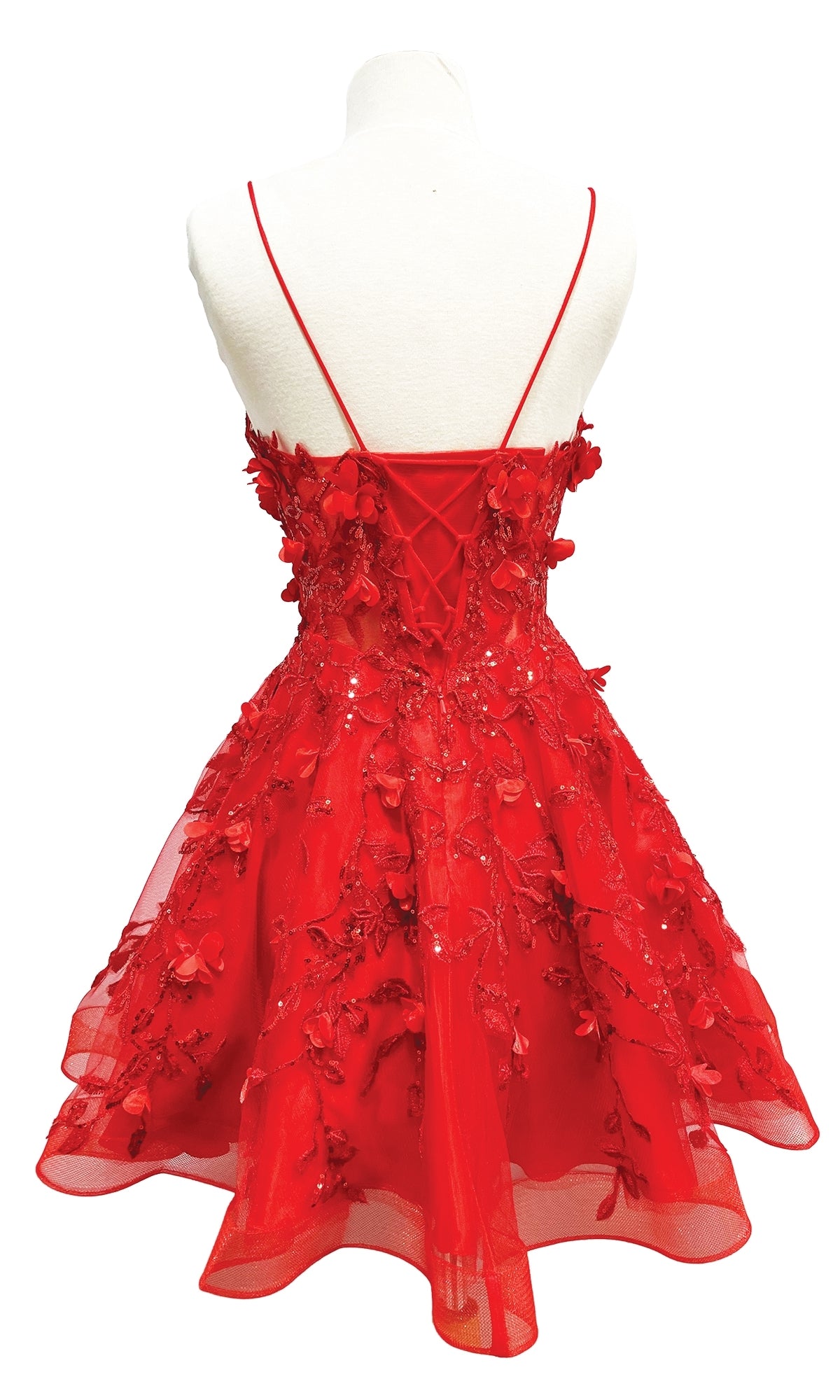The Embellished Short Babydoll Homecoming Dress 3357 is a red dress with thin straps, a lace-up corset back, and delicate 3-D floral embellishments, shown here displayed on a mannequin.