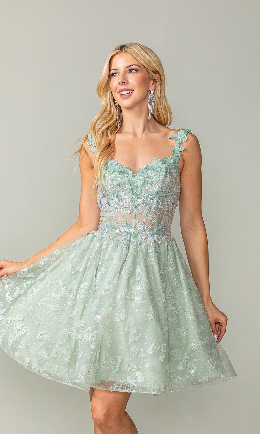 Woman wearing the Sparkly Short Butterfly Homecoming Dress 3361, featuring a light green floral lace A-line design with a sheer bodice and flared skirt, posing against a neutral background.