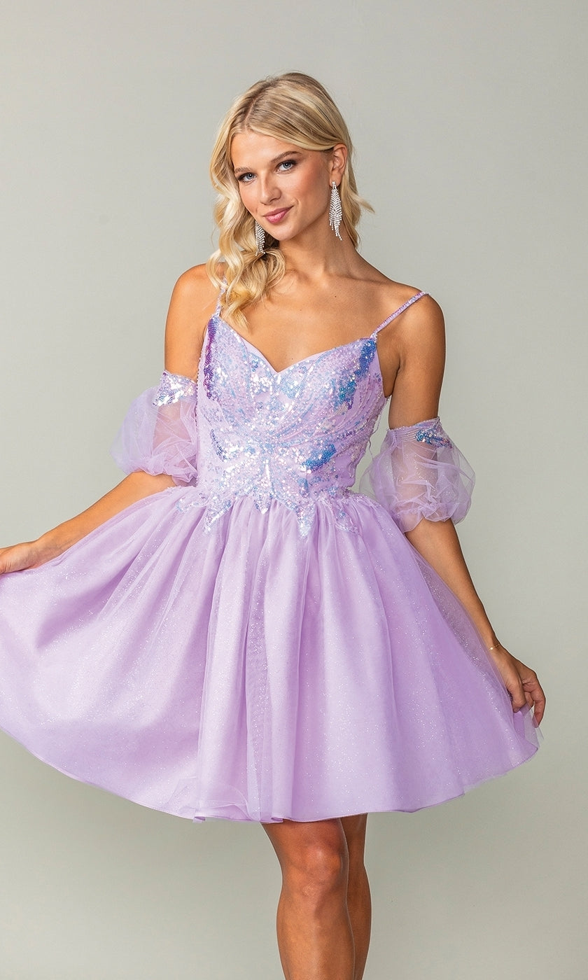 A woman poses against a plain background wearing the Puff-Sleeve Short Purple Homecoming Dress 3362, featuring sparkly fabric, off-the-shoulder tulle sleeves, and a semi-formal style.
