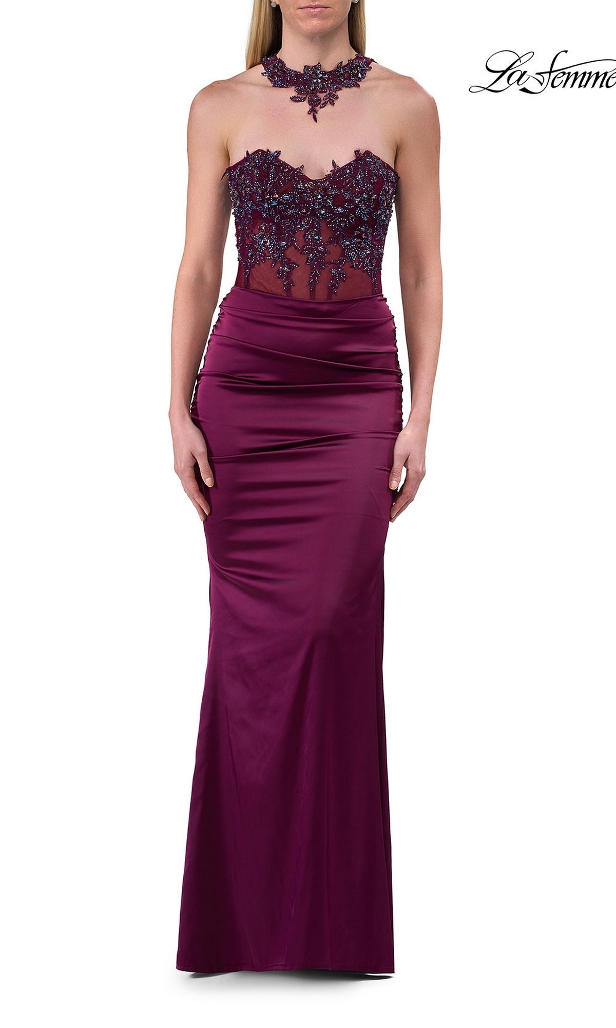 A woman wearing the Beaded-Lace-Choker Long Prom Dress (La Femme 33696) in Dark Berry, featuring a sleeveless, floor-length design with floral lace detailing on the bodice and neck, stands against a white background.