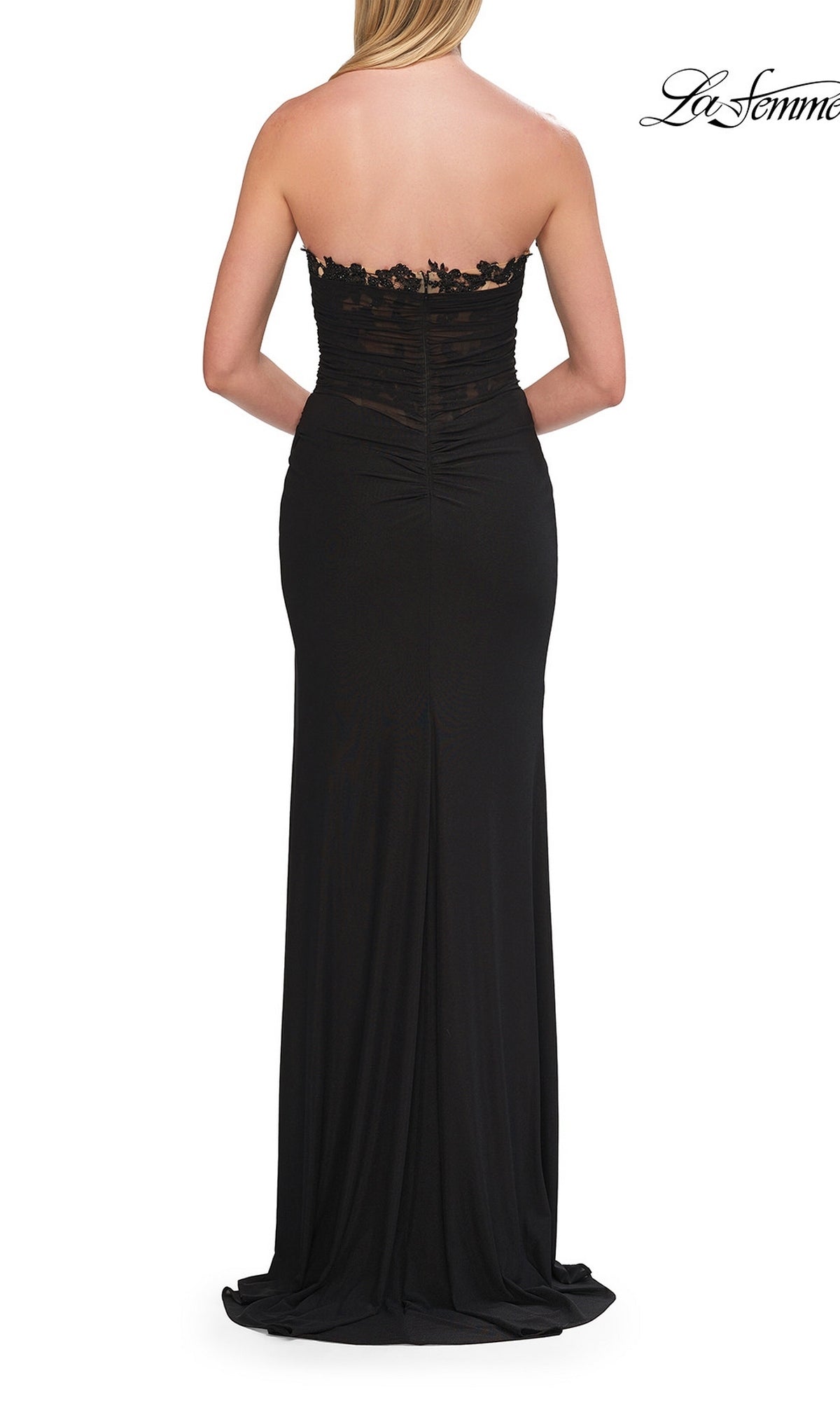 Woman wearing the Lace-Trim Strapless Long Prom Gown: La Femme 33704, featuring lace detailing on the bodice, shown from the back.