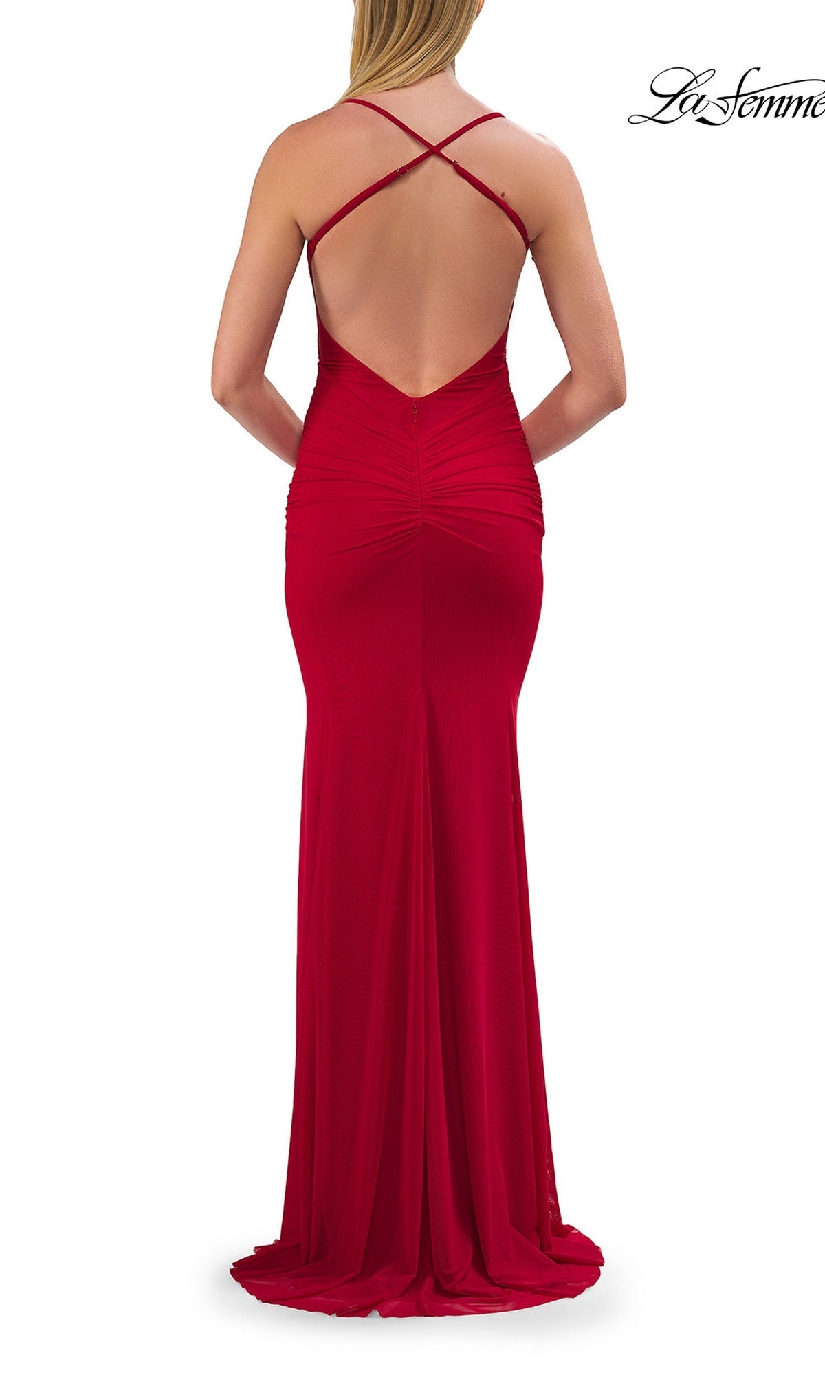 A woman in a red, floor-length Sheer-Sides Long Prom Dress La Femme 33708 with a strappy open back and crisscross straps, standing facing away on a white background.