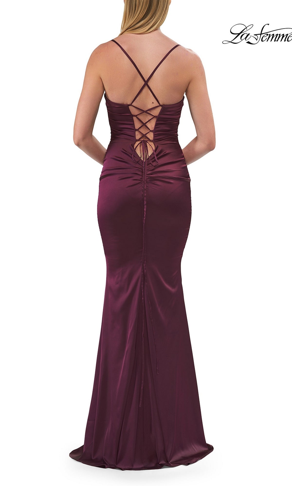 Woman in a sleeveless, floor-length, dark red satin Criss-Cross Open-Back Prom Gown by La Femme (style 33764), featuring lace-up back detail, viewed from behind.