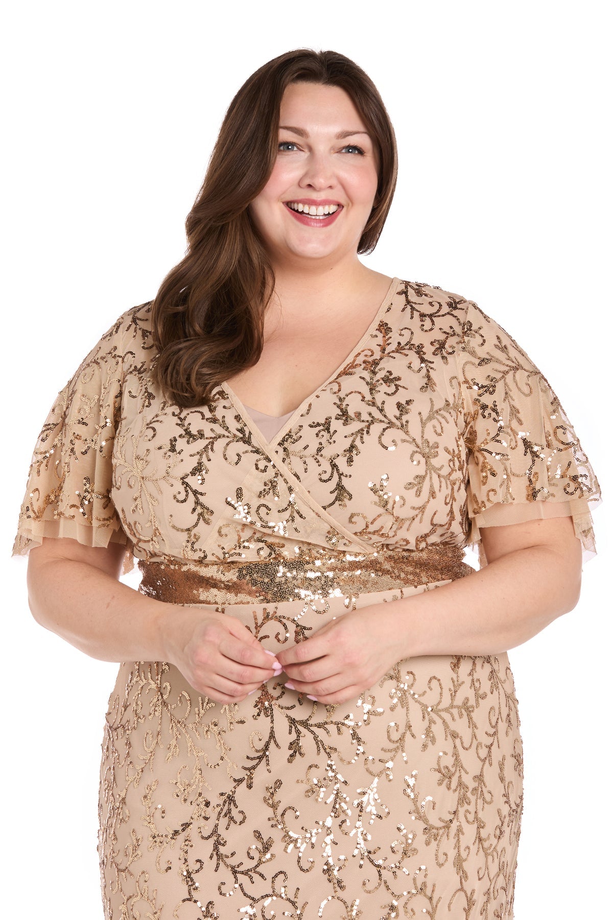 A woman smiles against a white background, wearing the beige Plus-Size Gold Formal Dress: R&M Richards 3425W adorned with sequins.