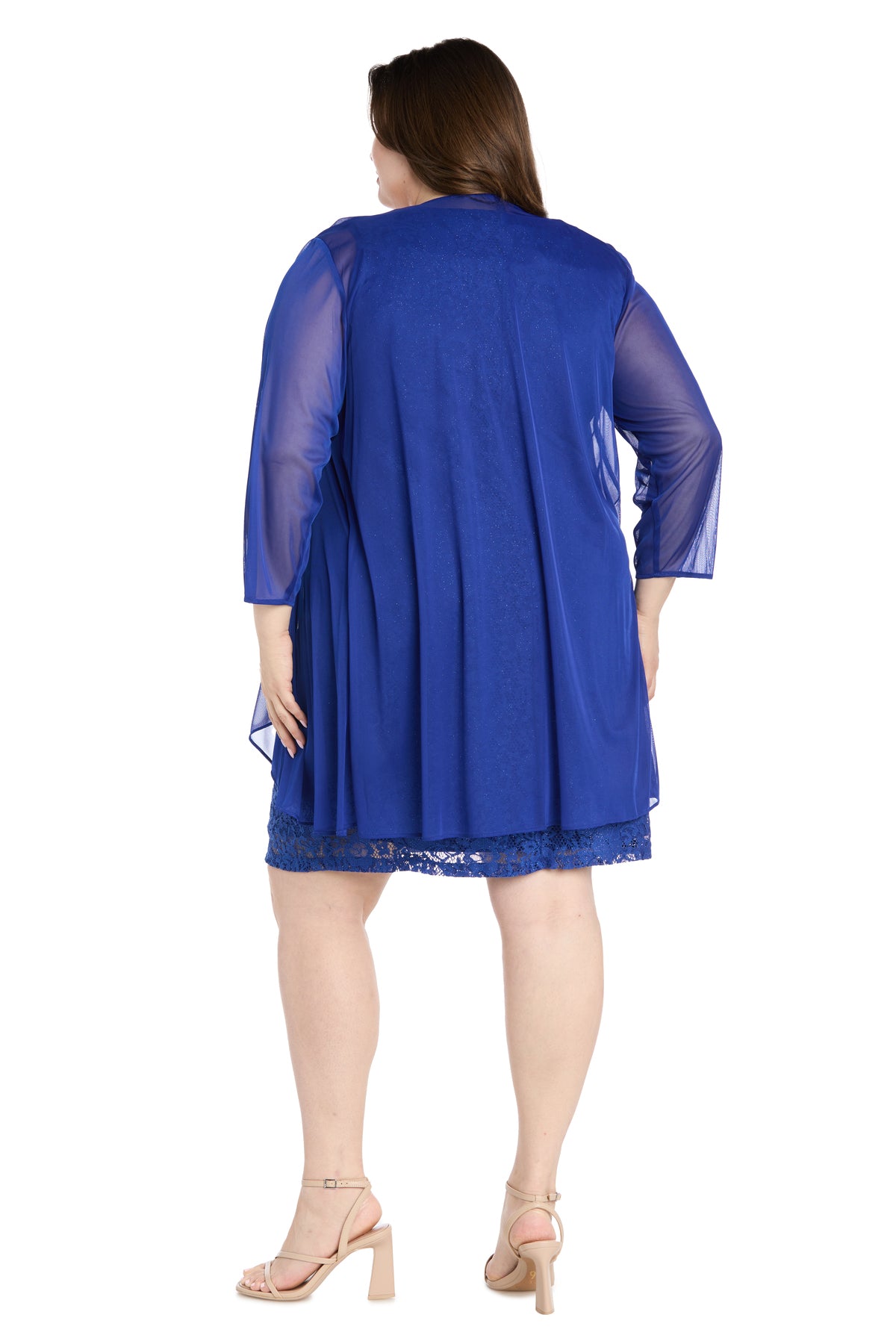 A woman is shown from the back wearing the R&M Richards 3594W Plus-Size Short Jacket Dress in royal blue with a matching sheer overlay and nude heeled sandals.