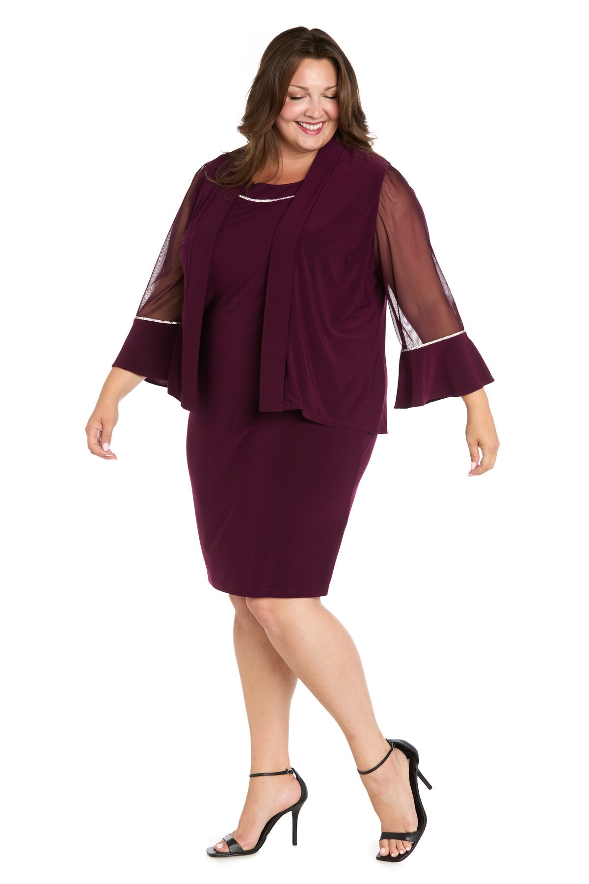 A woman in the R&M Richards 3747W short plus-size jacket party dress and black high-heeled sandals stands on a white background.