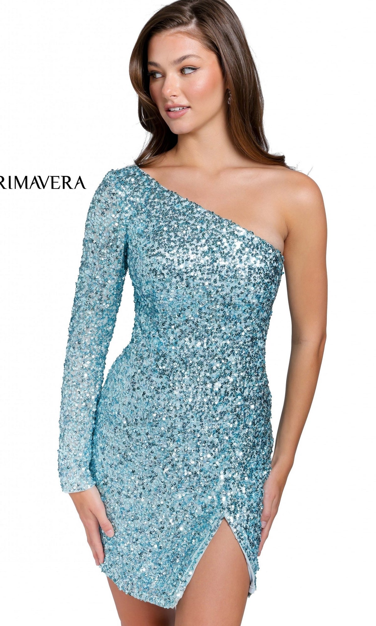 A woman wears the Faux-Wrap Beaded One-Sleeve Mini Party Dress 3860, featuring light blue sequins, an asymmetrical neckline, and a thigh-high slit, as she stands against a white background.