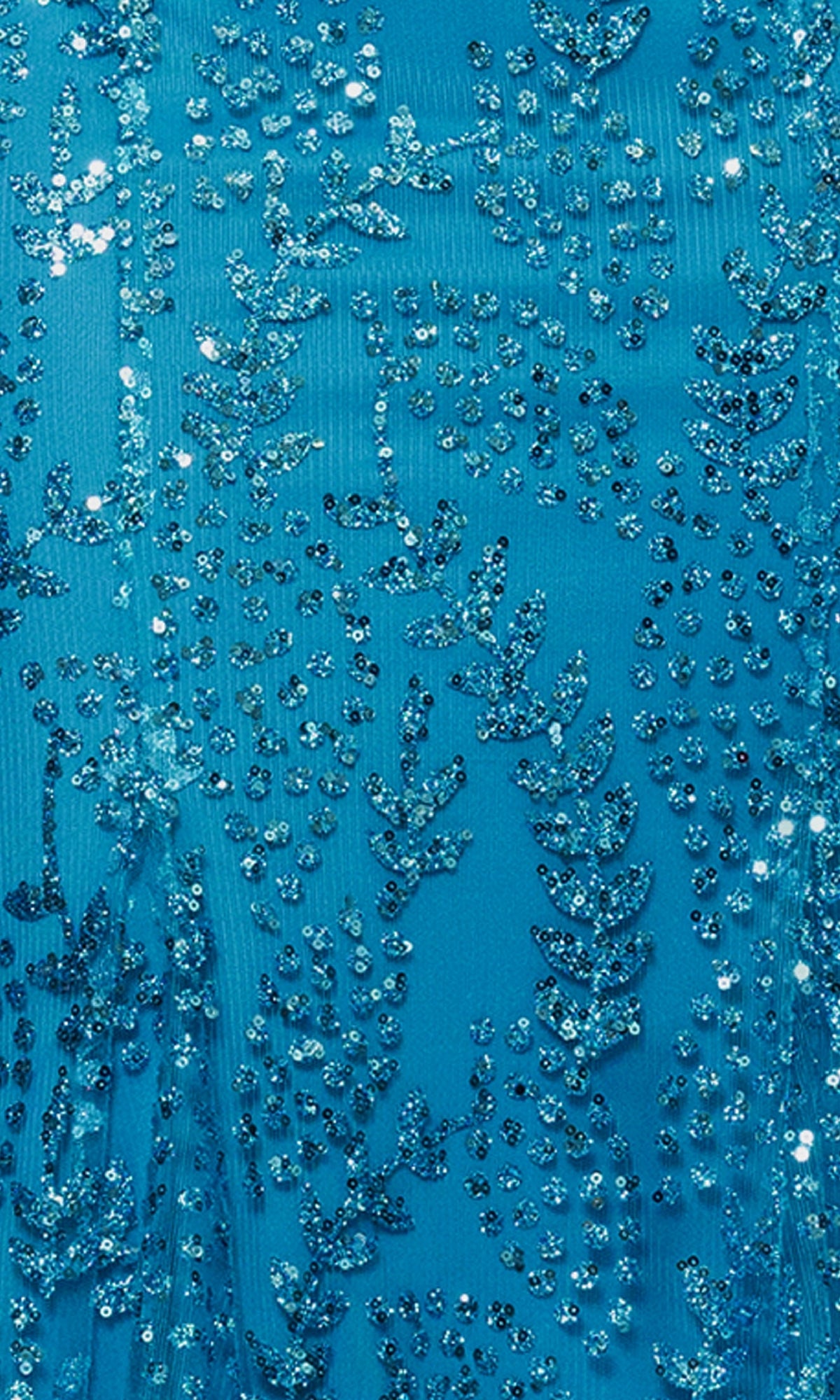 Close-up of blue fabric with intricate sequin and bead embroidery forming leaf and dotted patterns, featured on the Long Sequin-Print Prom Dress: Blondie Nites 3878BN—ideal for an affordable sparkling formal or prom dress.
