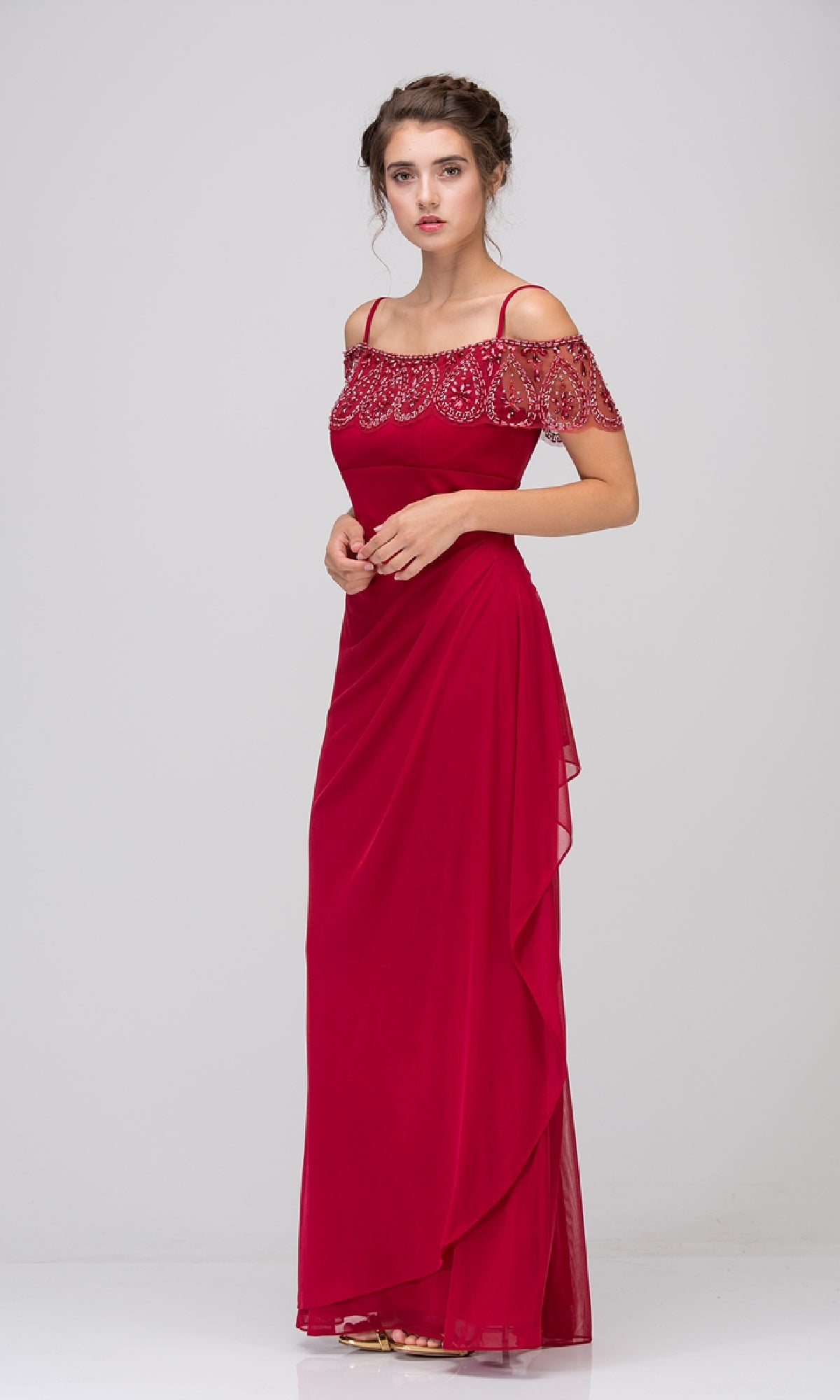 A woman models the Eureka 3937 Off-Shoulder Draped Long Formal Dress, featuring beaded details and flowing chiffon, standing against a plain light background—a show-stopping evening gown for any special event.