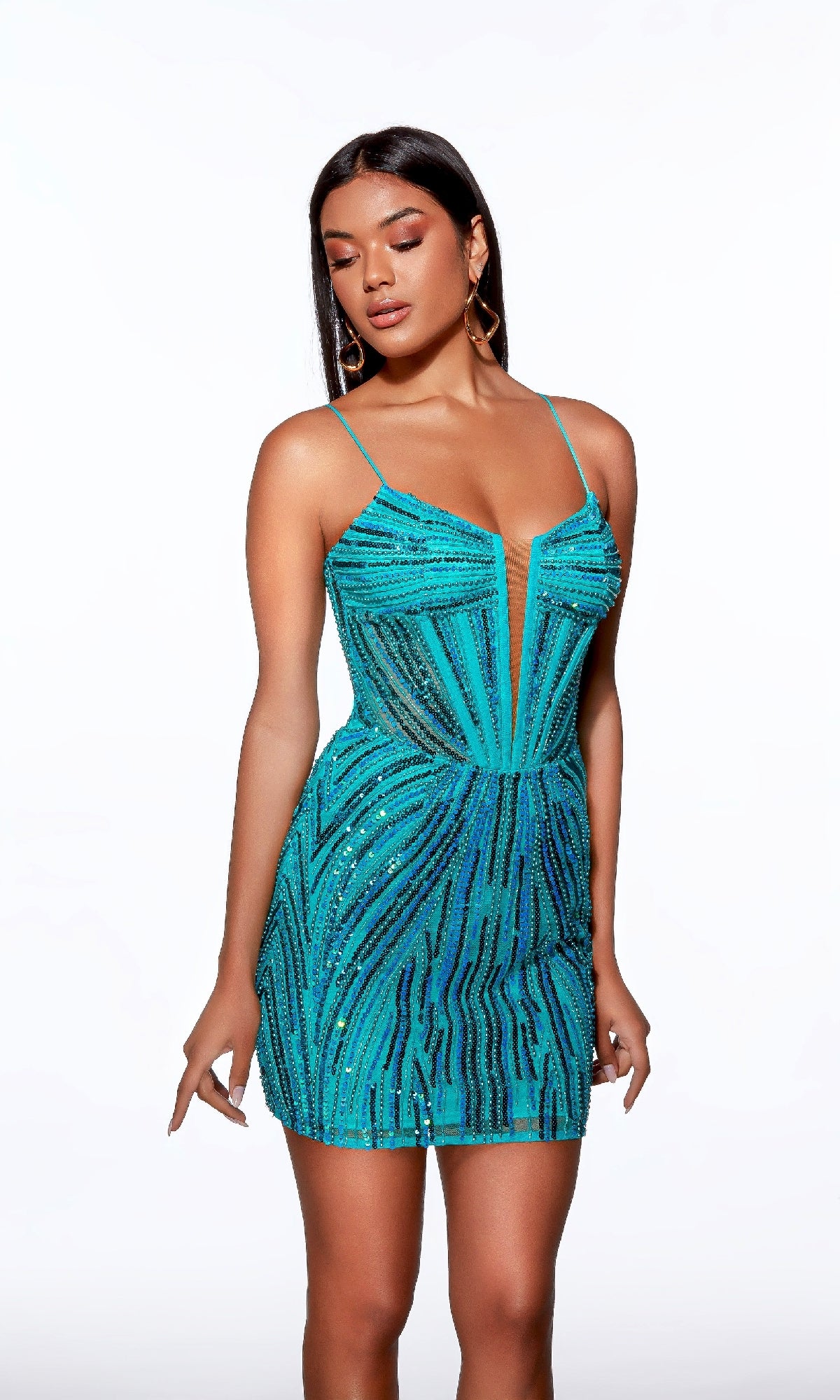 A woman models the Alyce 40016 short homecoming dress, a fitted turquoise mini with black and blue sequin stripes, deep V neckline, thin straps, and subtle rhinestone accents for extra sparkle.