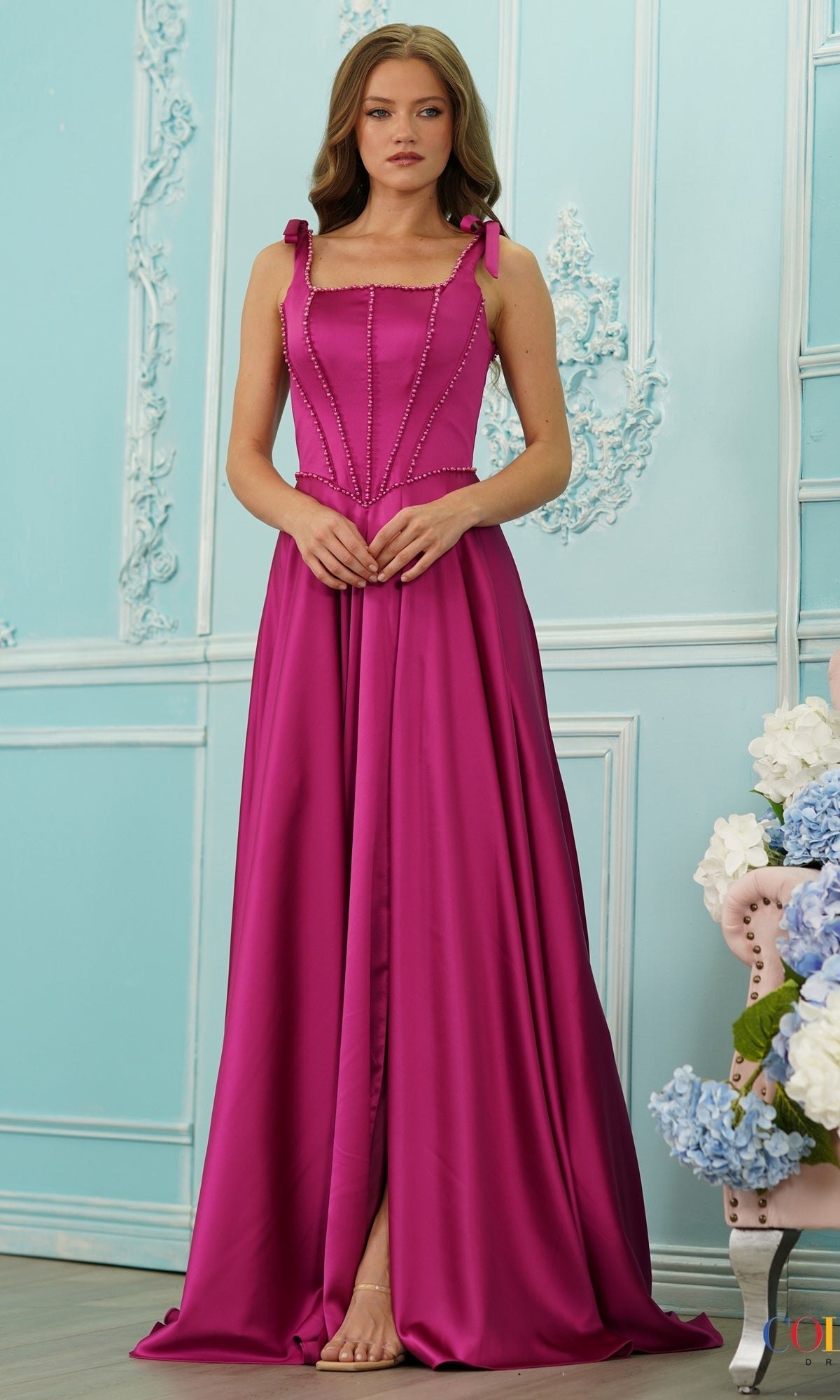 Colors Dress 4006 floor-length magenta beaded prom dress with a square neckline, corset bodice, and shoulder ties.