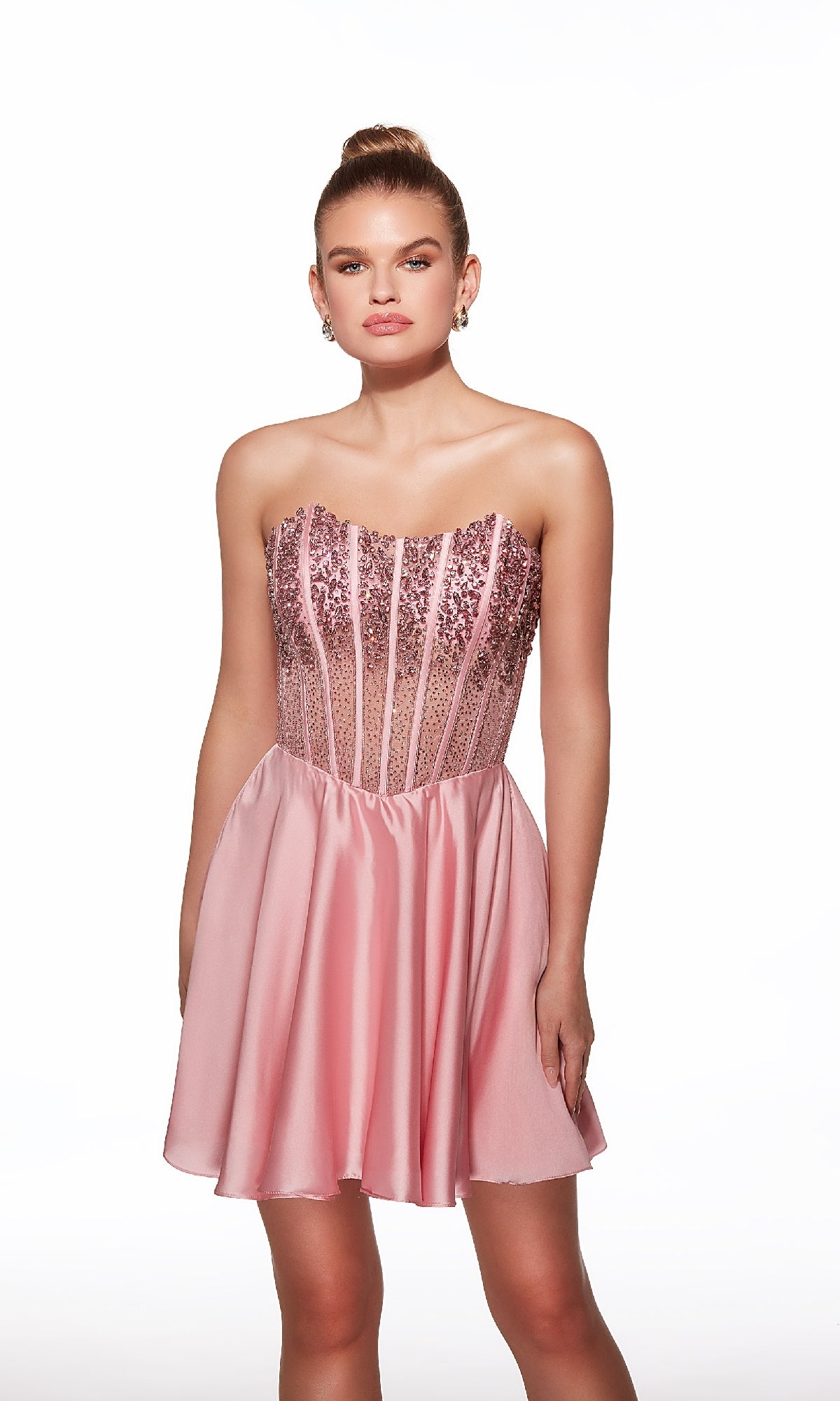 A woman wears the Alyce 40101 Strapless Short Corset Hoco Dress featuring a bead-embellished corset bodice and flared satin skirt, standing against a plain white background.
