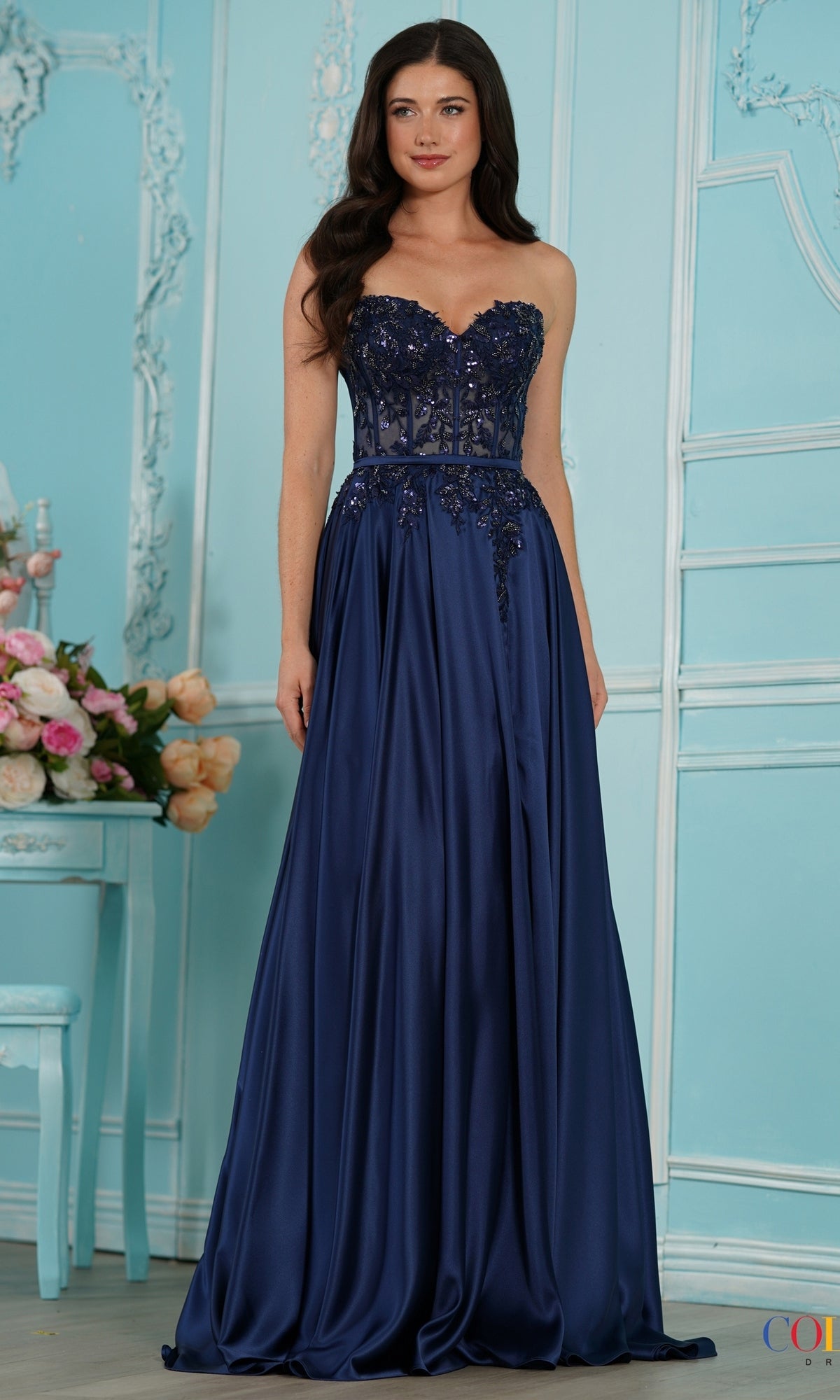 Long Prom Dress: Colors Dress 4025, a strapless navy blue floor-length satin gown featuring a beaded bodice and a full, smooth skirt.