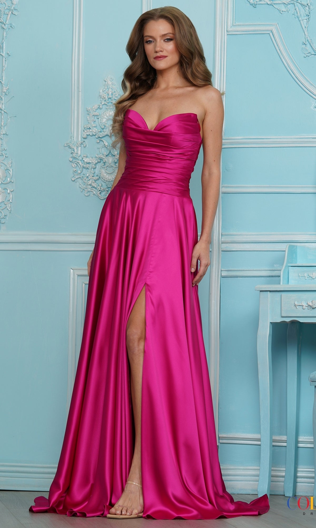 A fuchsia Colors Dress 4026 strapless floor-length gown with a sweetheart neckline, high side slit, and draped old Hollywood silhouette.