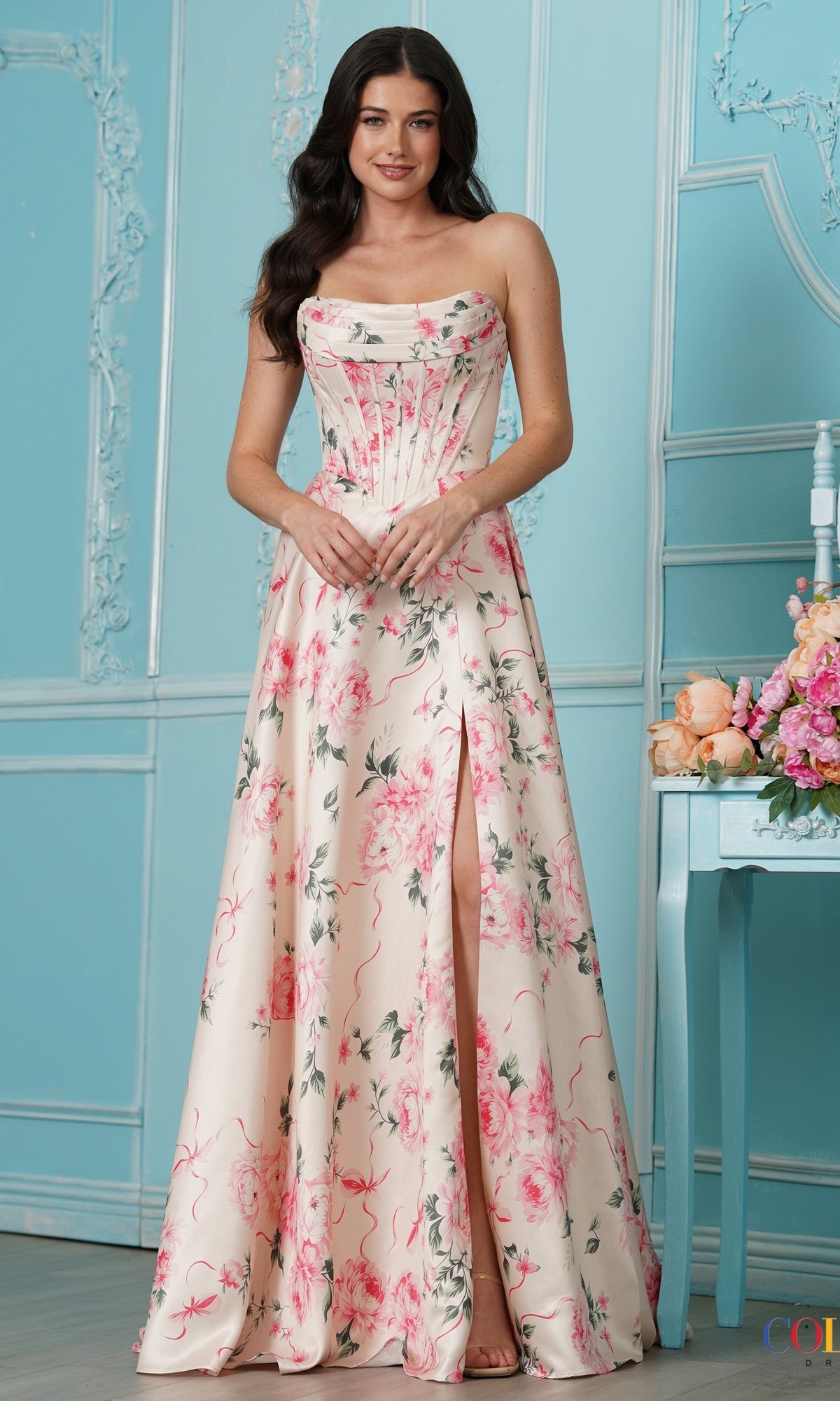 A strapless, floor-length yellow floral Long Prom Dress: Colors Dress 4031 with a corset-style bodice and a side leg slit.