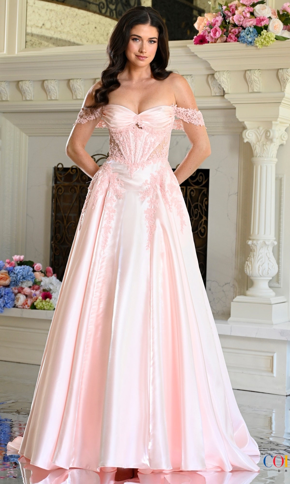 A blush pink Long Prom Dress: Colors Dress 4150, featuring an off-the-shoulder lace bodice with delicate detailing and a full, floor-length A-line skirt.