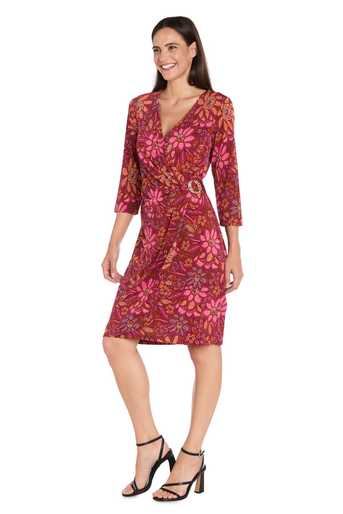 A woman stands against a white background, wearing the R&M Richards 4171 red knee-length party dress and black heeled sandals.
