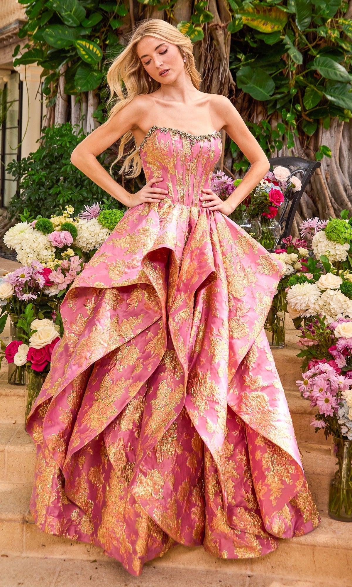 Strapless pink and gold Long Prom Dress: Ava Presley 42541 with a beaded bodice and a layered, voluminous skirt.