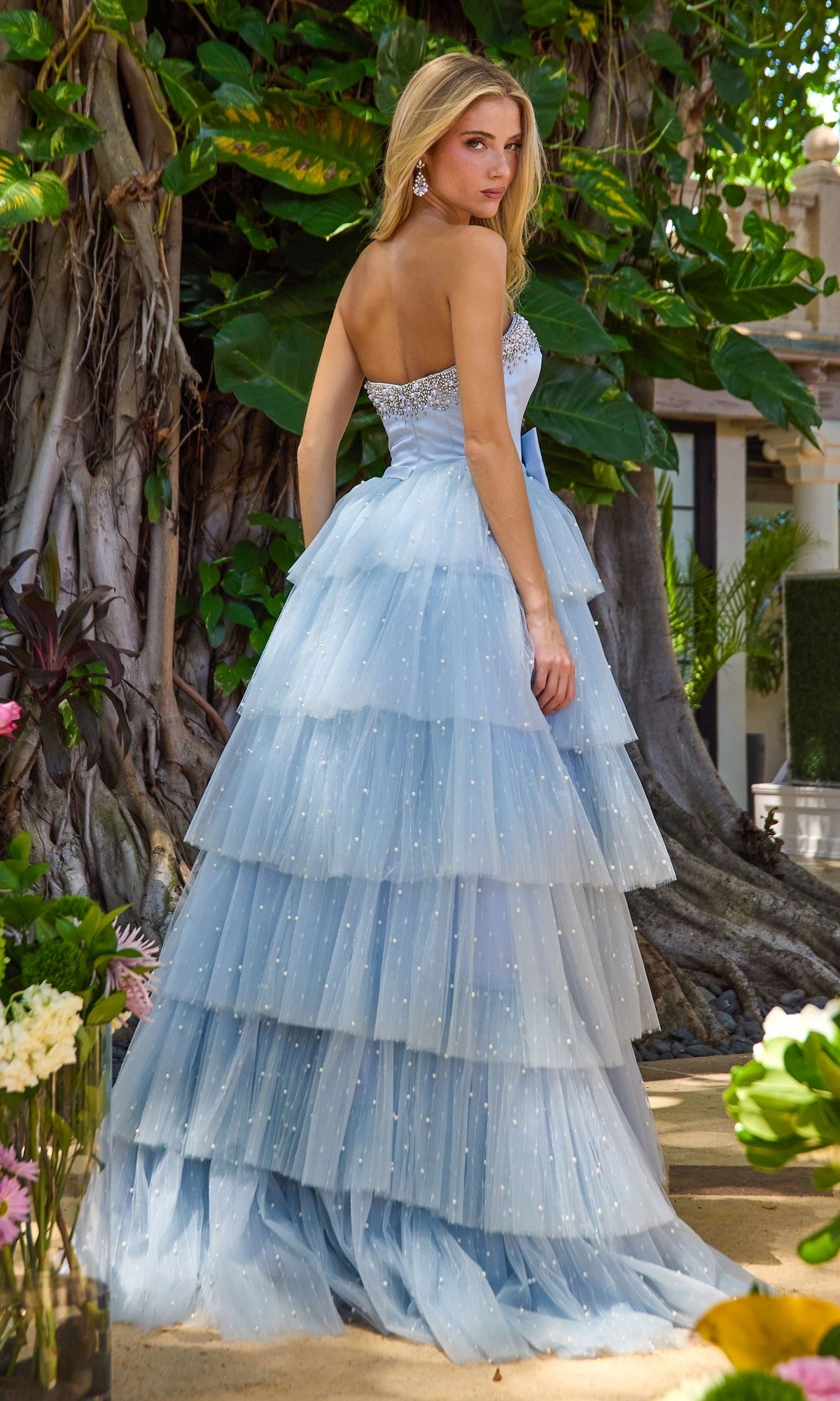 Long Prom Dress: Ava Presley 42589 in a strapless, light blue tiered ruffled ball gown style with a beaded bodice and pearl embellishments.