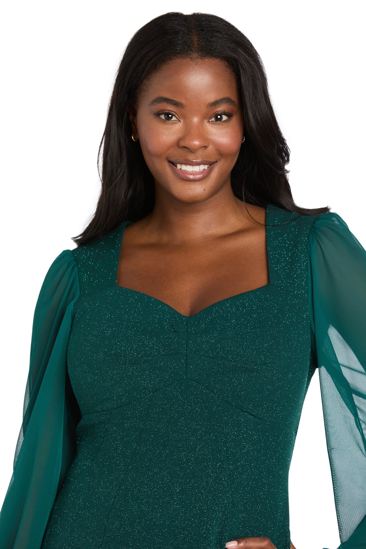 A woman with long dark hair smiles at the camera, wearing the Petite Short Green Party Dress, R&M Richards 4331P, against a white background.