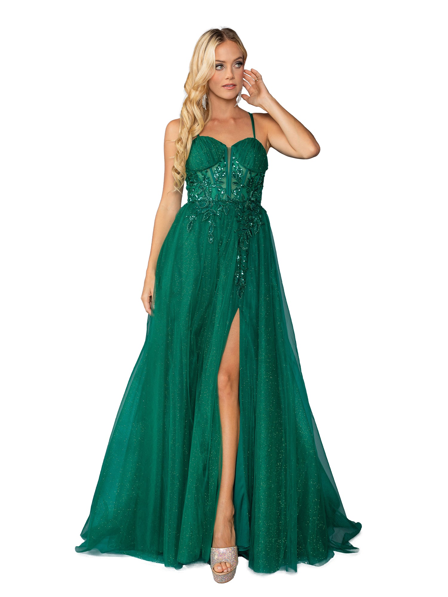 A woman wears the Long Prom Dress 4393 by Dancing Queen—an emerald green, floor-length gown with a corset bodice, thin straps, slit skirt, and sequin details—standing against a white background.
