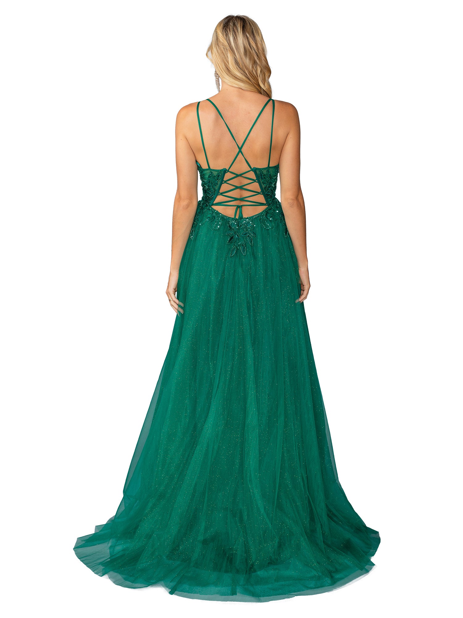 A woman faces away from the camera in the Long Prom Dress 4393 by Dancing Queen, featuring green tulle, an a-line silhouette, thin straps, and a lace-up back.
