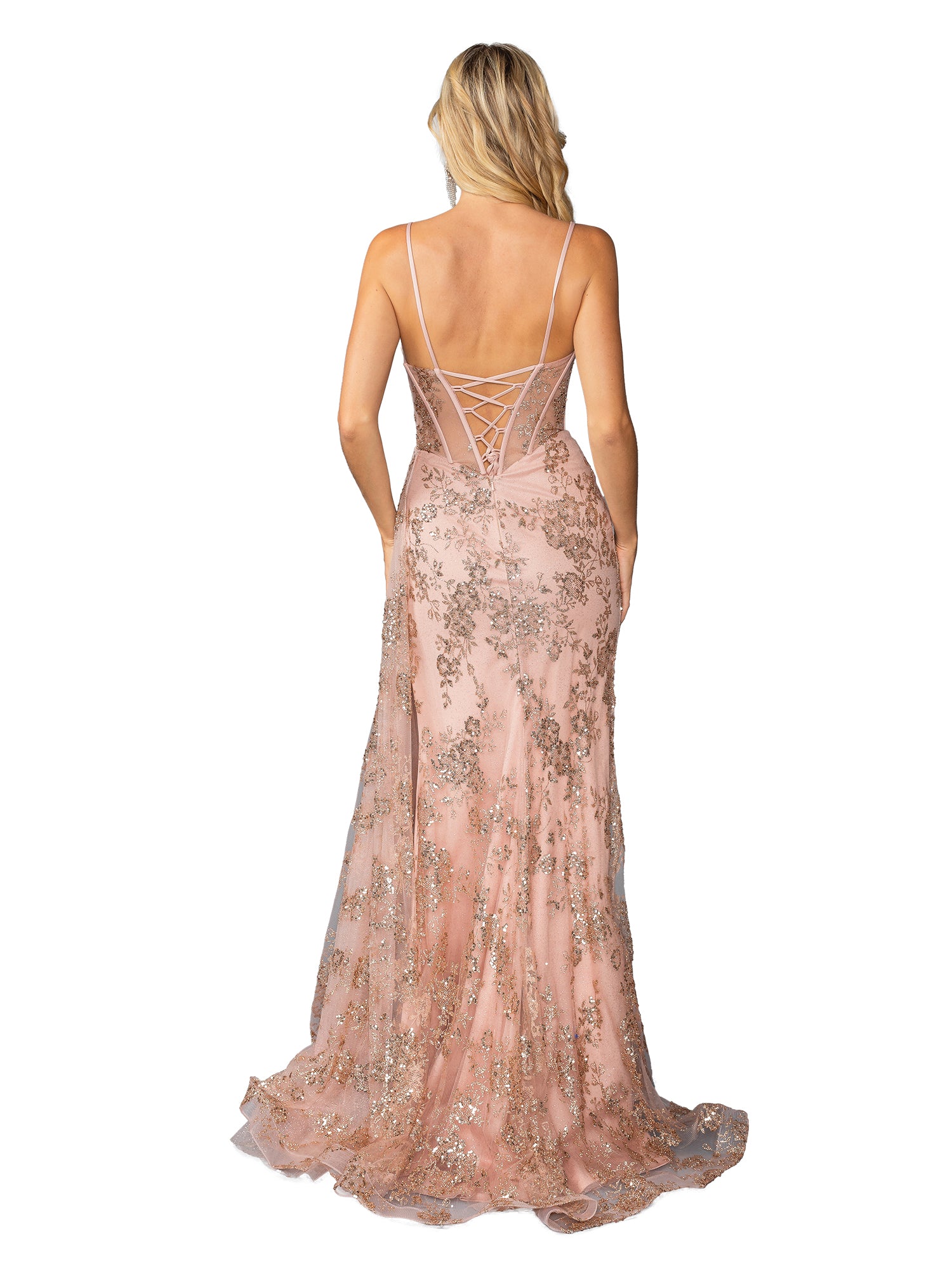 A blonde woman wears the Glitter-Print Long Prom Dress: Dancing Queen 4425, a blush pink sequin-embellished gown with a corset-style bodice, lace-up back, and thin straps, standing against a white background.