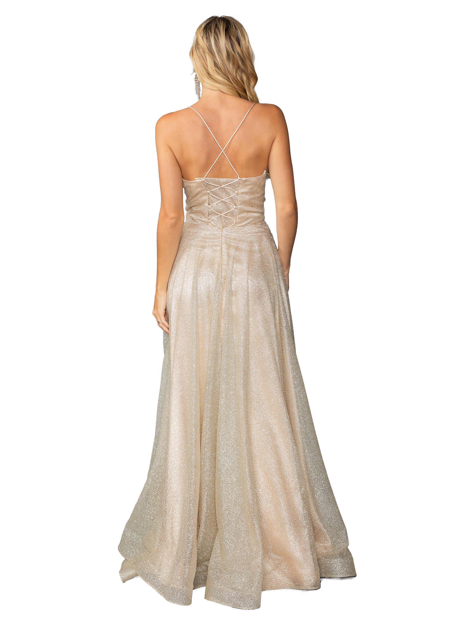 A woman is seen from behind in the Dancing Queen 4428, a long glitter prom ball gown in champagne with a lace-up back and thin crisscross straps.