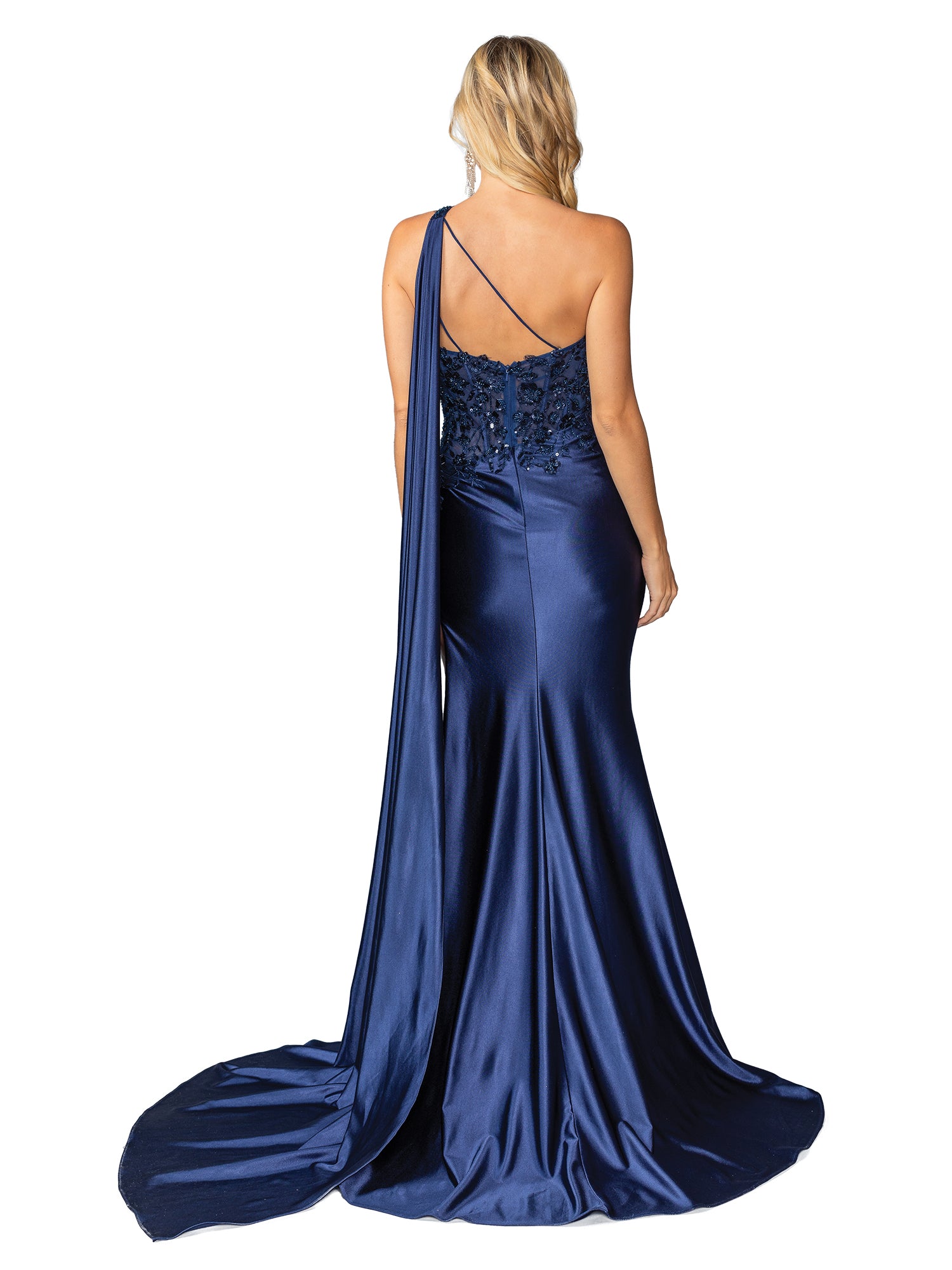 A woman faces away from the camera in the One-Shoulder Long Prom Dress: Dancing Queen 4441, a dark blue satin gown with a floor-length train, beaded-lace bodice detail, and single back strap.