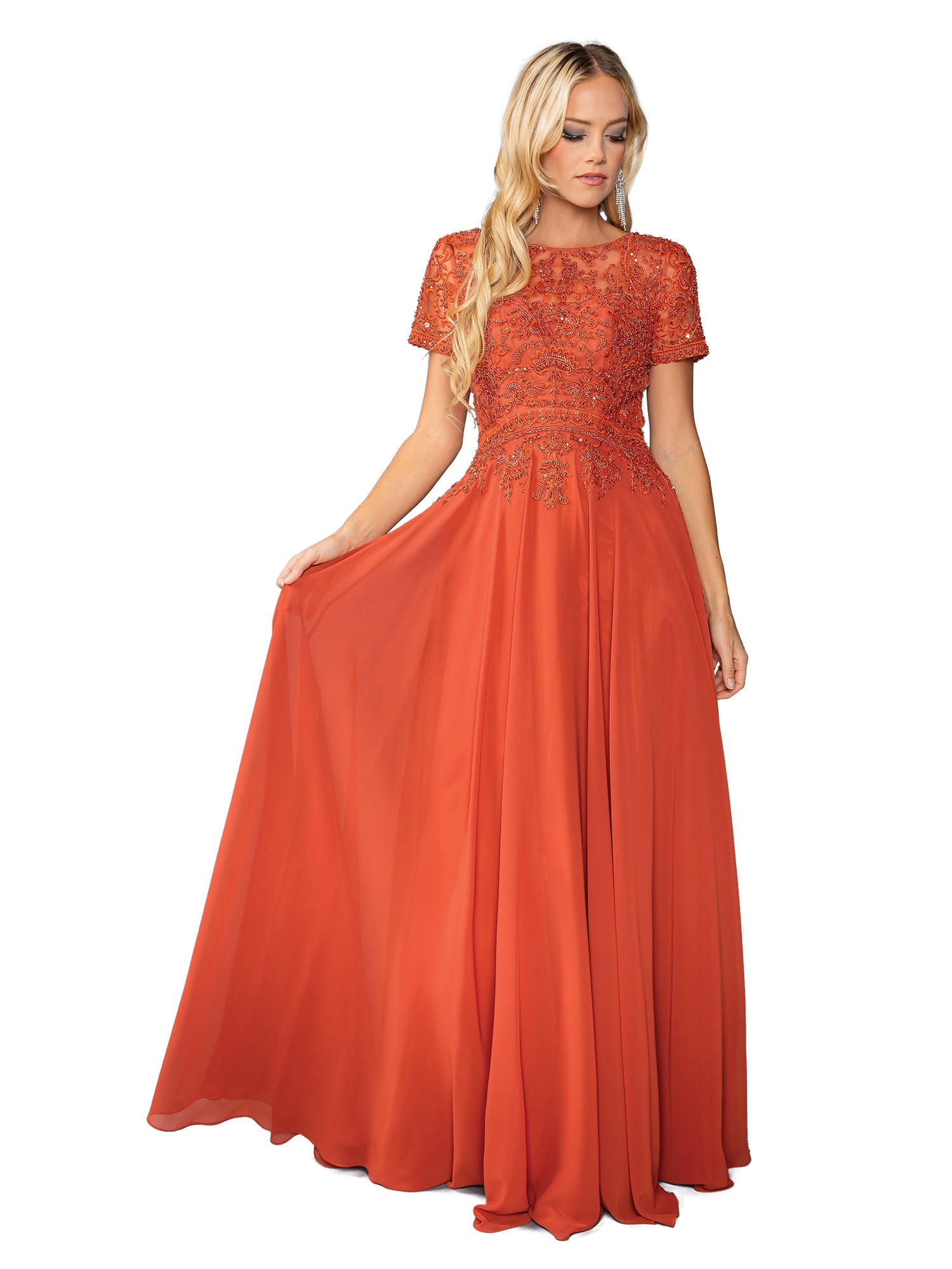 A woman wears the Beaded-Bodice Long Prom Dress: Dancing Queen 4444, an orange floor-length gown with a beaded-lace bodice, short sleeves, and a flowing skirt.