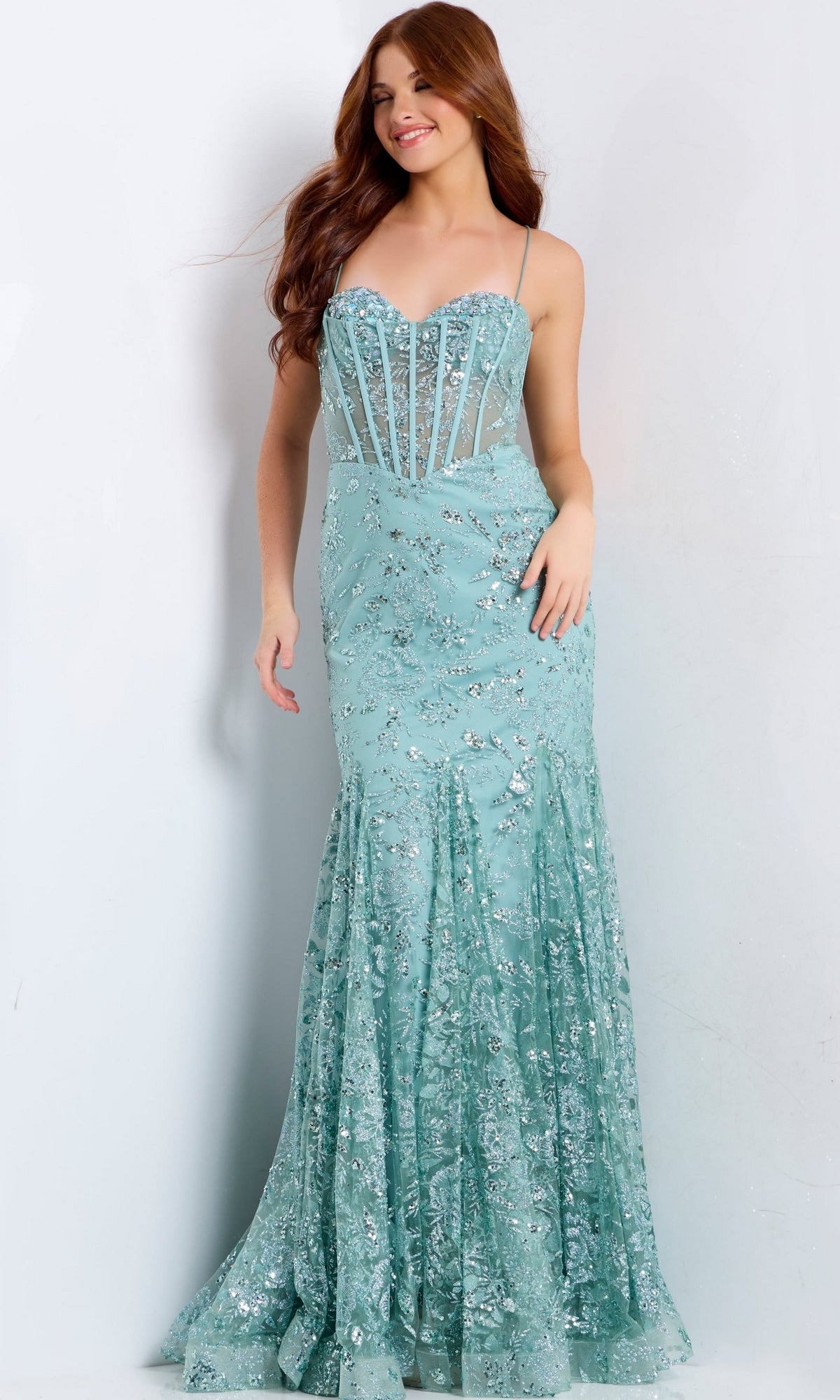 Jovani 45759 is a light blue strapless mermaid gown featuring a sequin floral corset bodice and intricate silver embroidery.