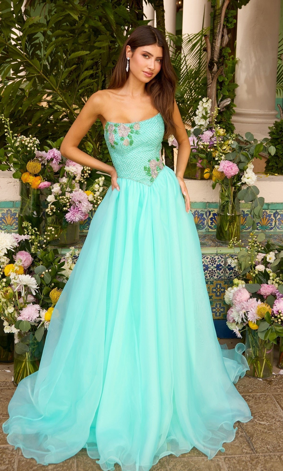 An Ava Presley 47424 strapless aqua ball gown with a structured, floral-embellished bodice and a full, floor-length skirt.
