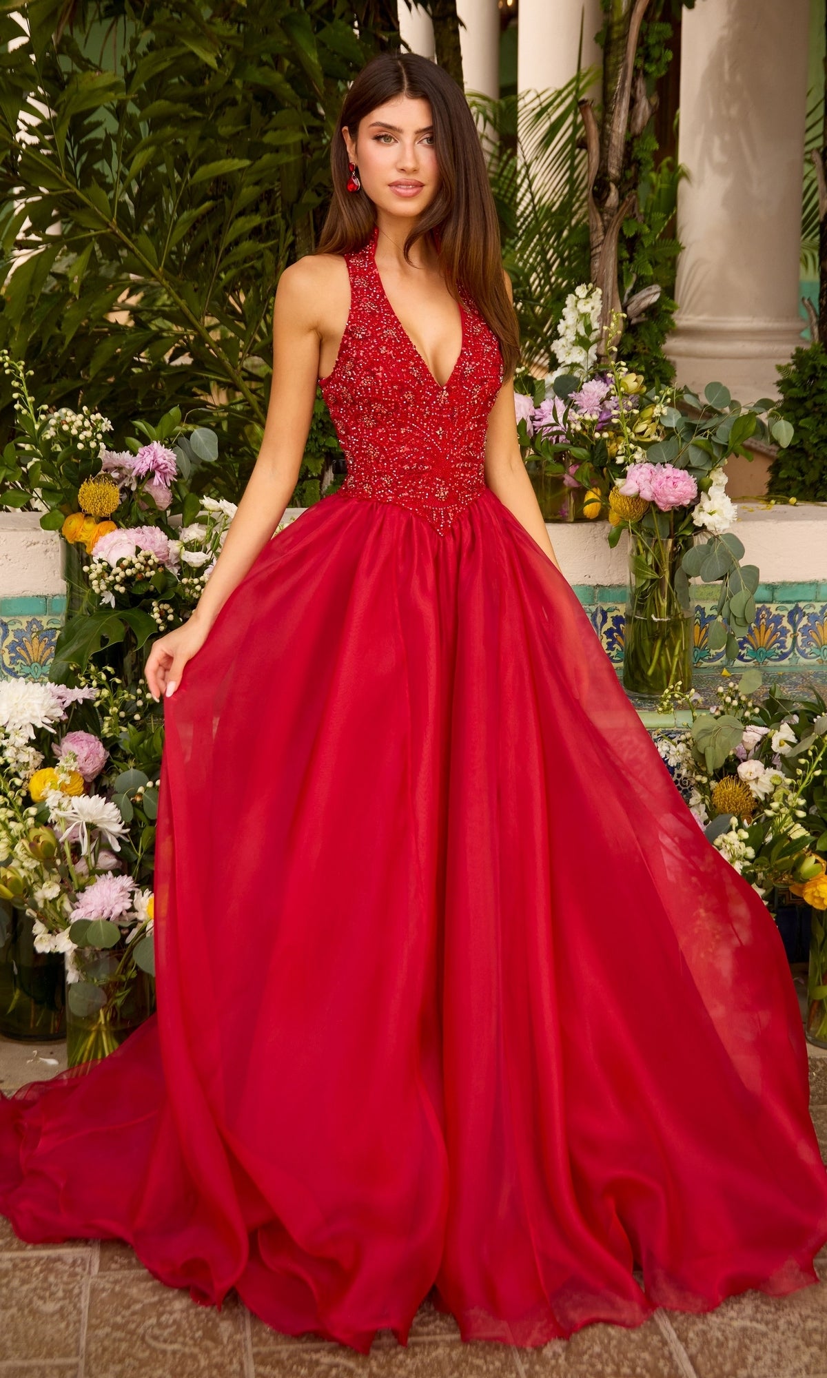 Ava Presley 47425 red, floor-length halter prom dress featuring a beaded, v-neck bodice and a full, flowing skirt.