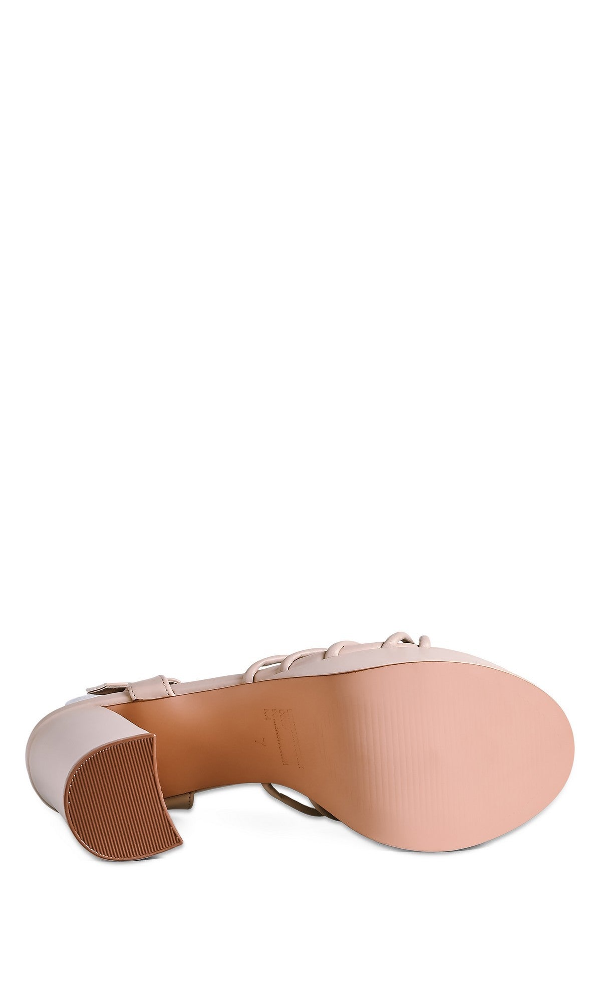 The Tiara Nude Prom Shoes by Touch Ups 4761 are women's faux-leather platform shoes in a light, neutral hue, featuring a smooth sole and square heel with ridged tread on the heel tip as seen from the bottom.