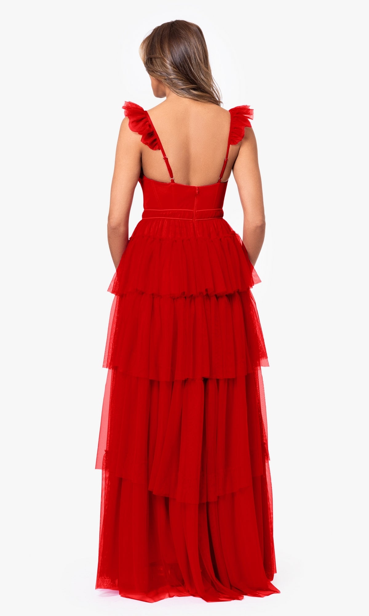 A woman is shown from the back wearing the Blondie Nites 4819BN Ruffled Tiered Long Prom Dress, featuring sleeveless design, ruffled shoulder straps, and tiered layers, set against a plain white background.