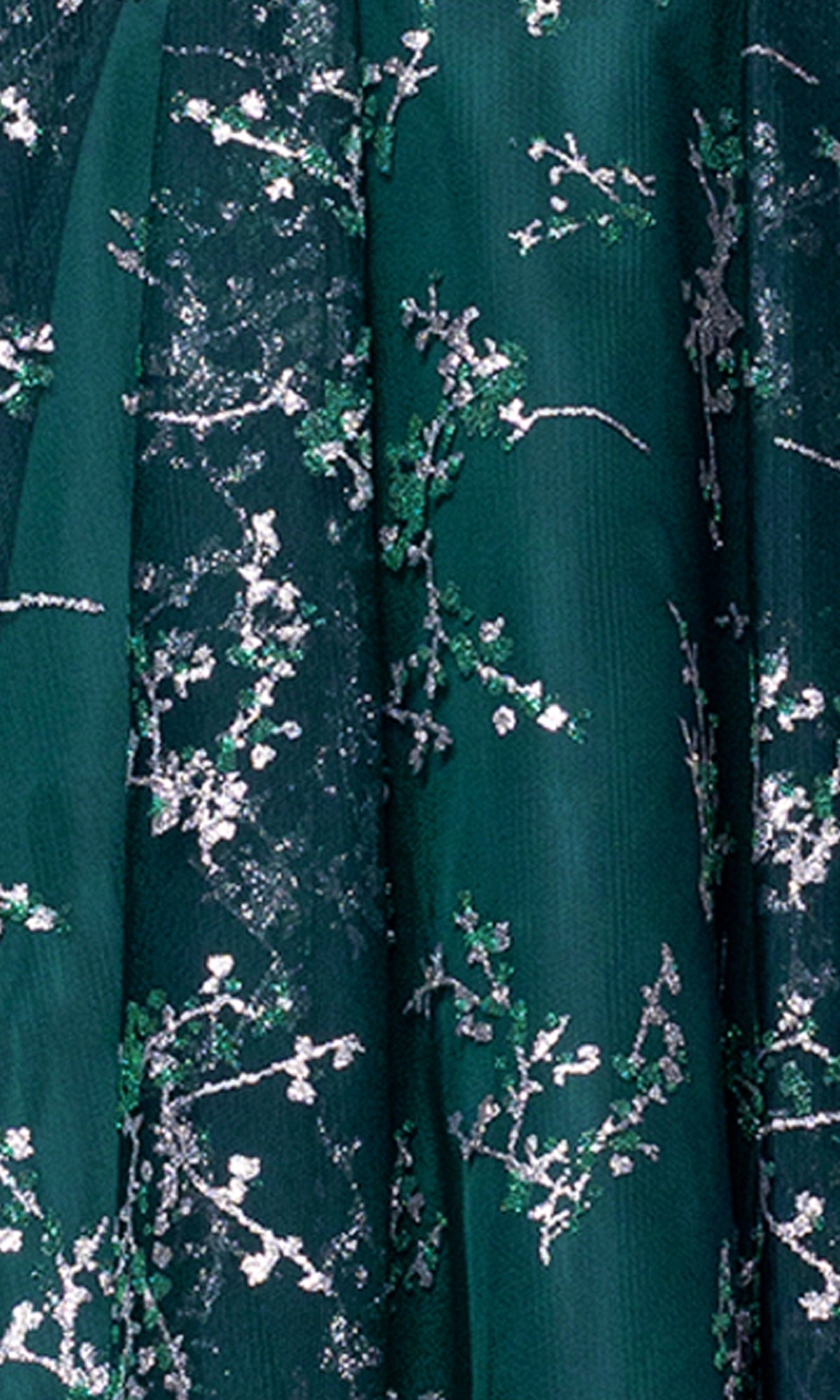 Close-up of dark green fabric with silver and green embroidered floral patterns from the Short Glitter Hoco Dress: Blondie Nites 4884BN—perfect for a sparkling party or junior homecoming look.