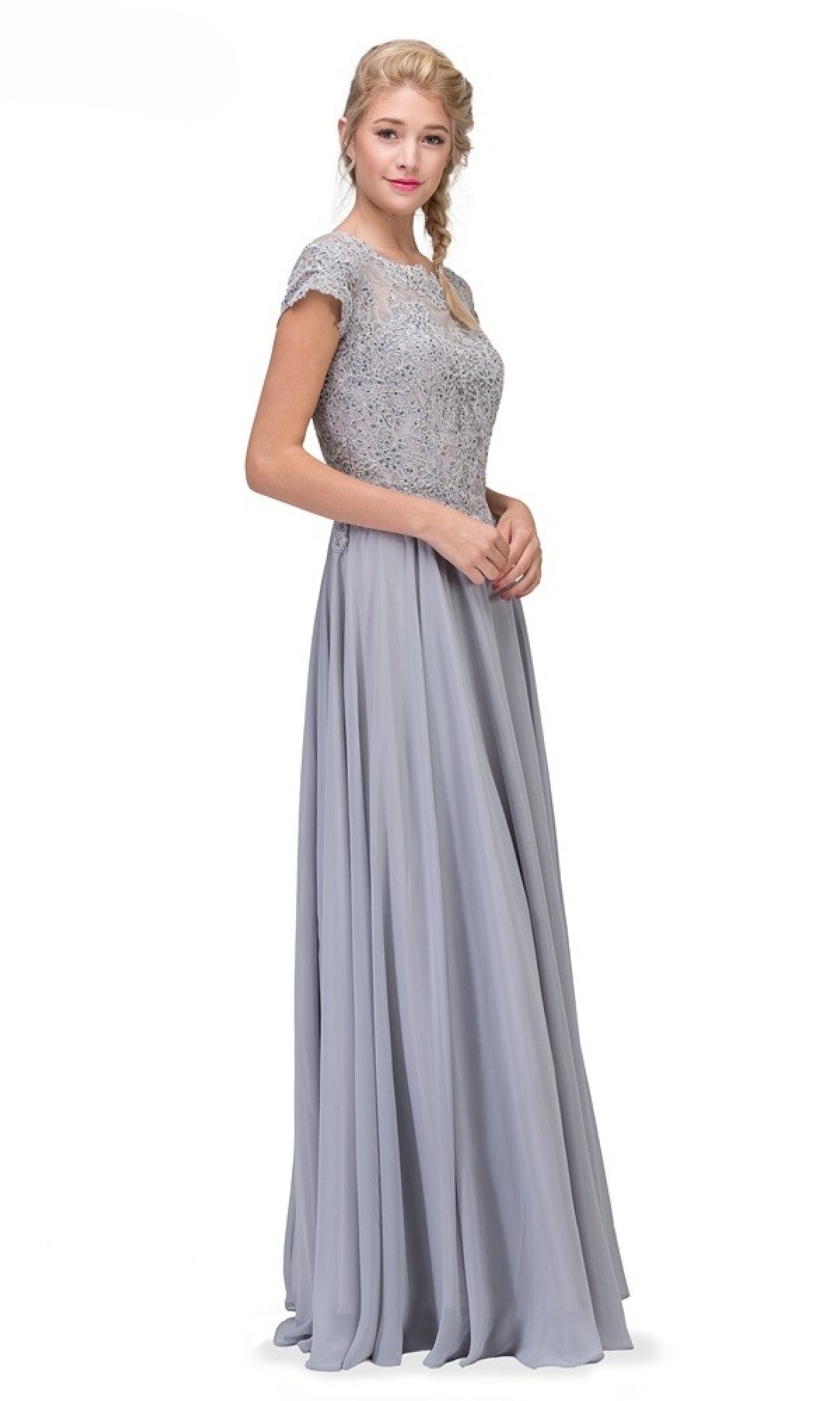 A woman wears the Short-Sleeve Long A-Line Formal Dress: Eureka 4909, featuring a light gray floor-length skirt and an embroidered lace bodice, standing against a plain white background.