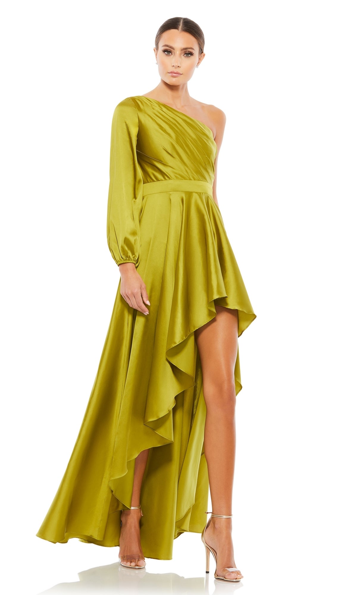 A woman models the Mac Duggal 49141 One-Sleeve High-Low Prom Dress in lime green with strappy heels, standing against a white background.