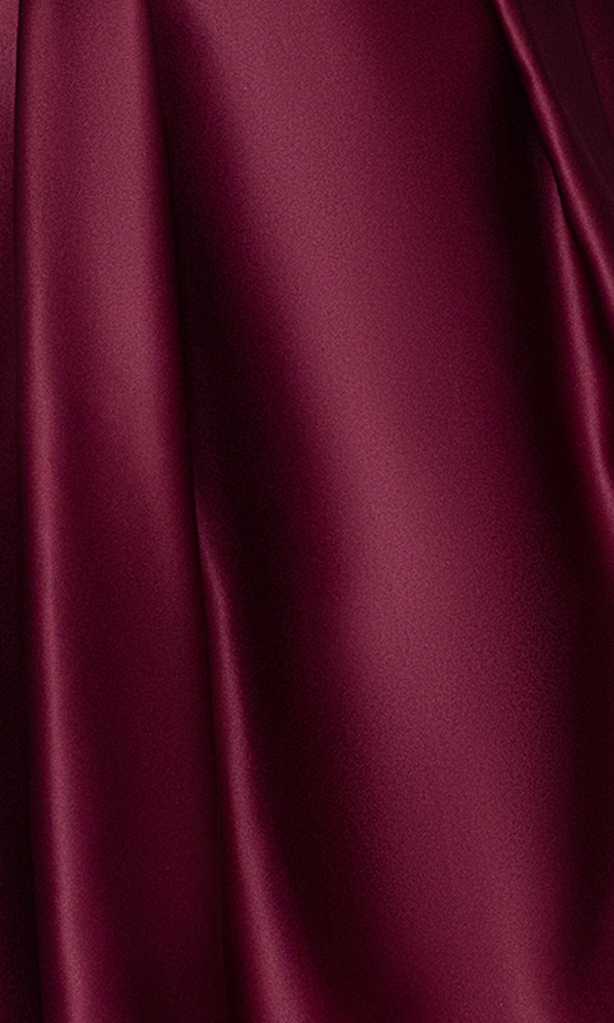Close-up of smooth, burgundy satin fabric with a soft sheen, featured in the Plus Short Wine Hoco Dress: Blondie Nites 4927BNW—perfect for an elegant wine red party or plus-size homecoming look.